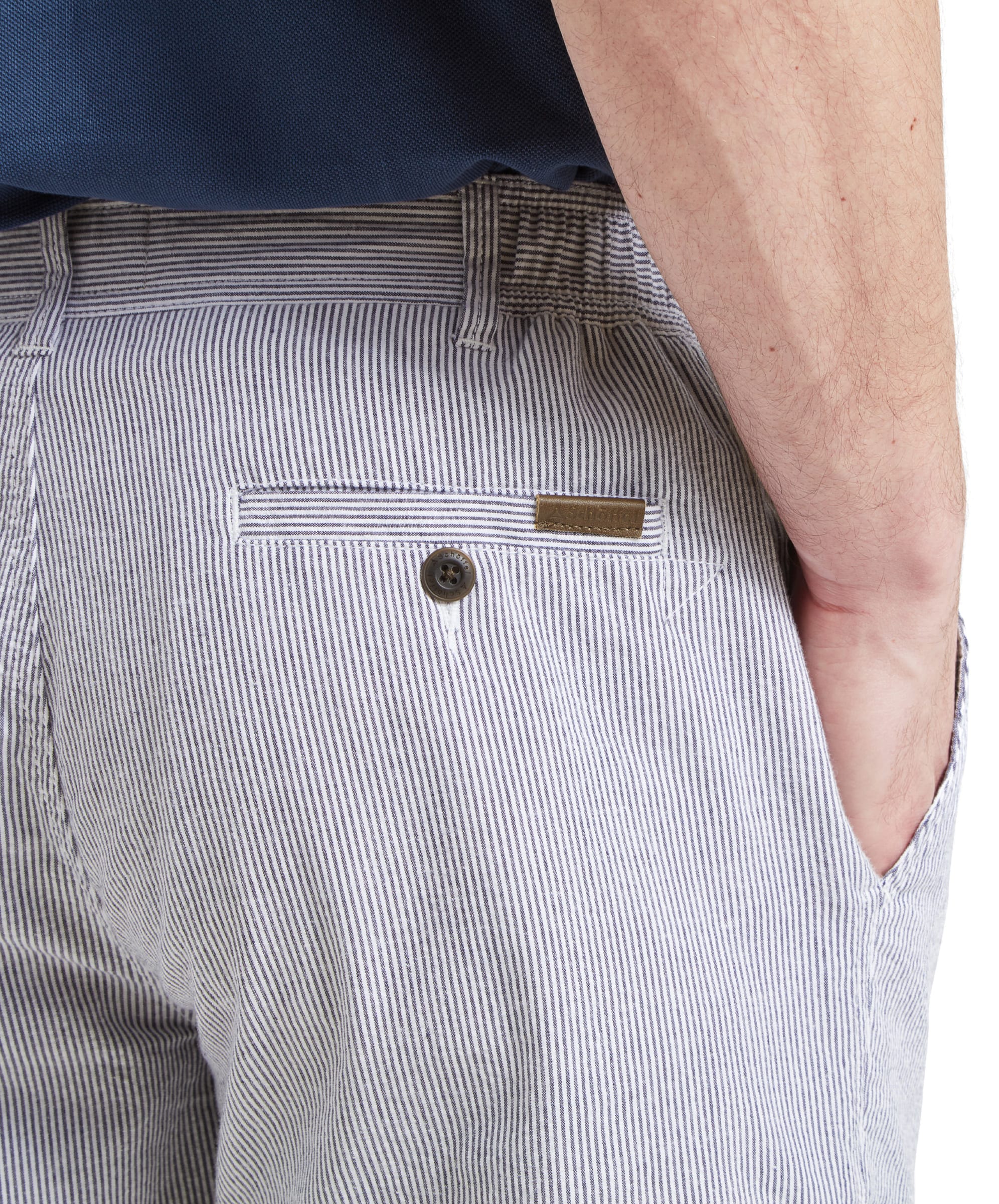 A close-up shot of the back pocket of the Schöffel Abersoch Shorts for Men in Navy, showing the pocket button and fabric details.