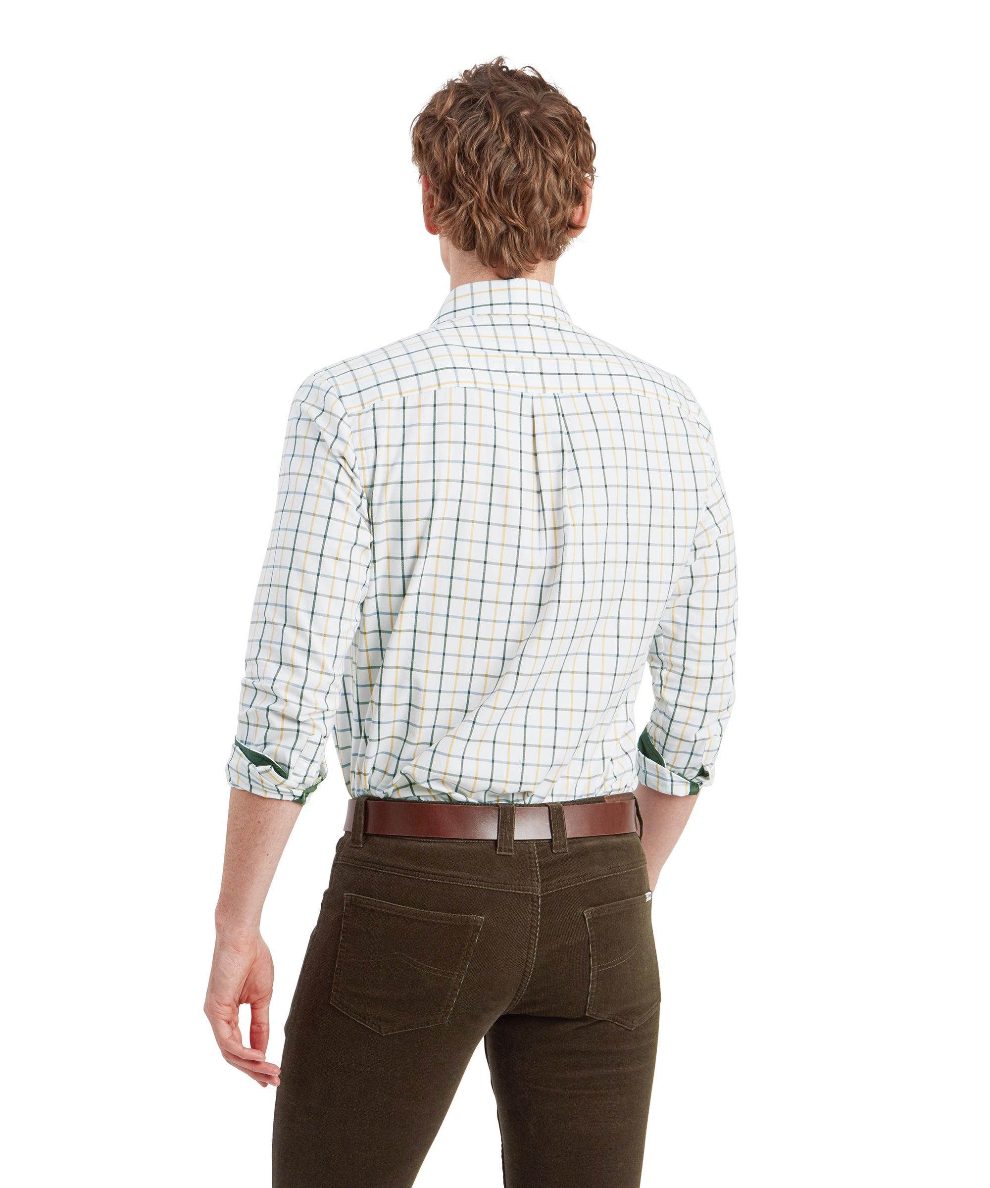 Back view of the man, showing the rear fit of the Schöffel Baconsthorpe Tailored Shirt for Men in Green and pants. The shirt fits smoothly across his back, with a single pleat near the shoulders. The pants are slim-fit, highlighting the clean and streamlined look. The brown leather belt is visible, complementing the outfit.