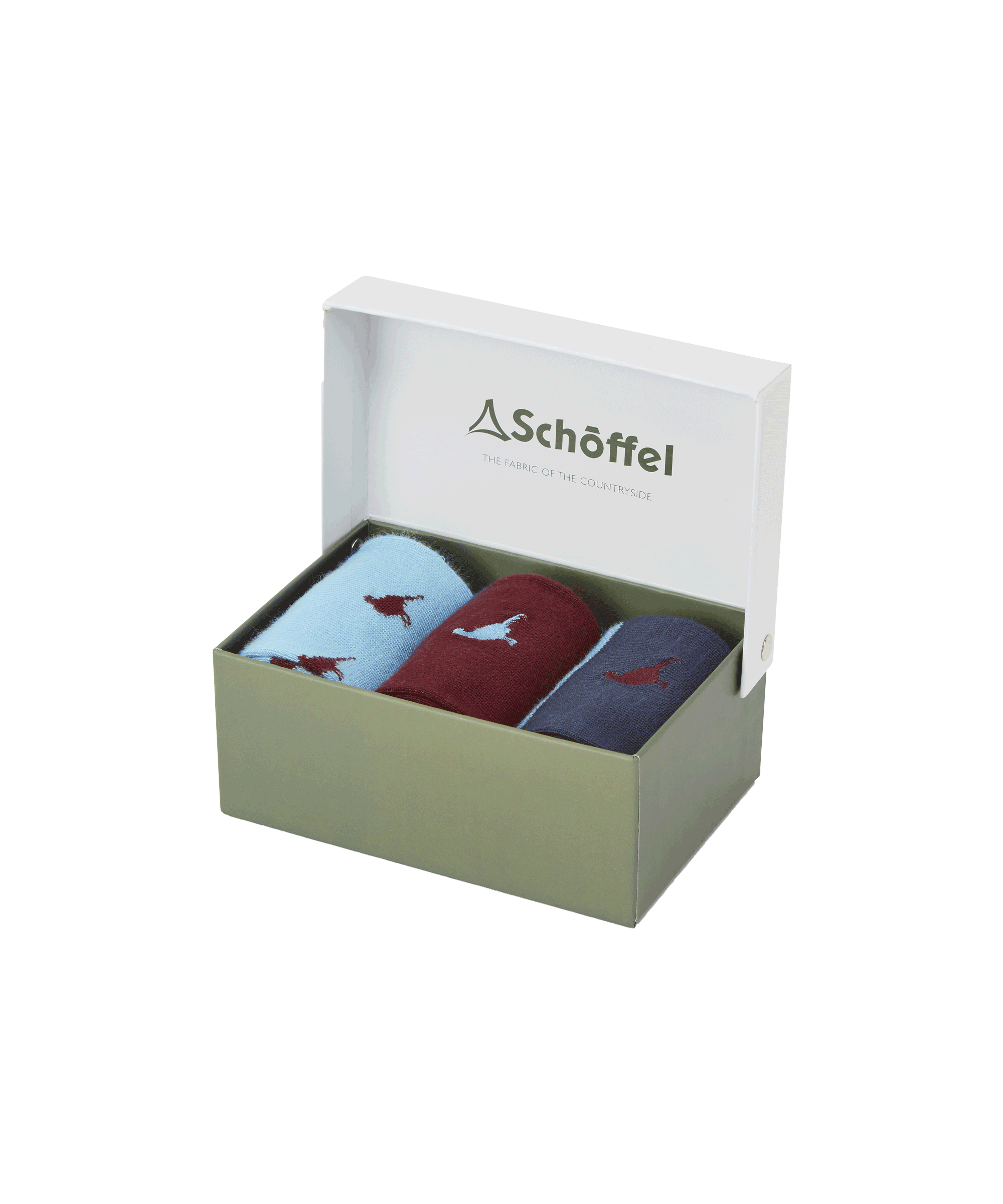 A light green box with a white lid partially open, displaying the Schöffel Bamboo Sock Box of 3 for Men in Red inside. The socks are in different colors: one pair is light blue with red dog embroidery, another is maroon with light blue dog embroidery, and the third is navy blue with red dog embroidery. The inside of the lid features the "Schöffel" logo and the tagline "The Fabric of the Countryside."