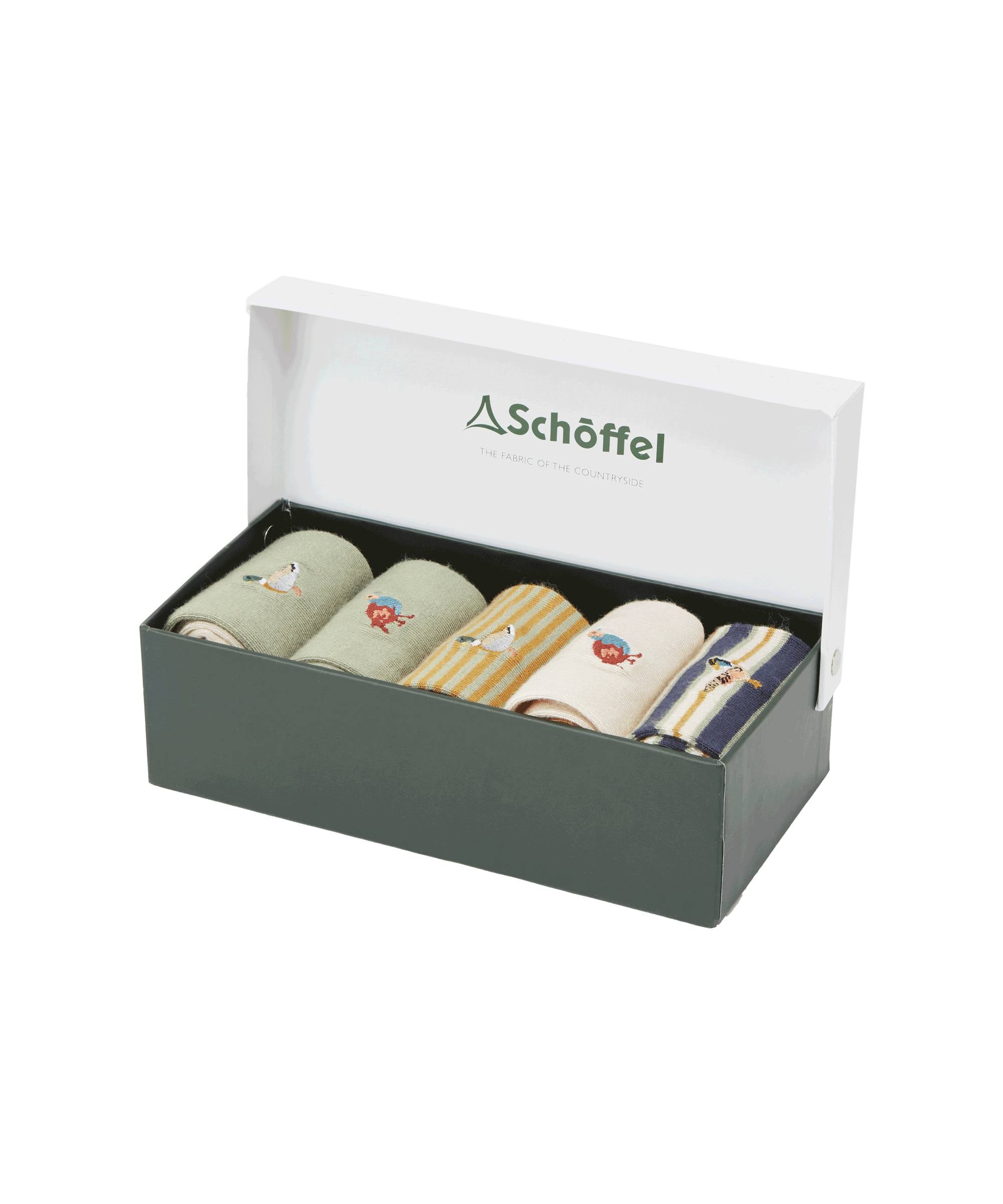 A dark green box with a white lid partially open, displaying the Schöffel Bamboo Sock Box of 5 for Men in Brown inside. The socks feature various designs: light green with a bird embroidery, beige with a red dog embroidery, yellow and white stripes with a bird embroidery, beige with a red dog embroidery, and navy blue and beige stripes with a bird embroidery. The inside of the lid features the "Schöffel" logo and the tagline "The Fabric of the Countryside."