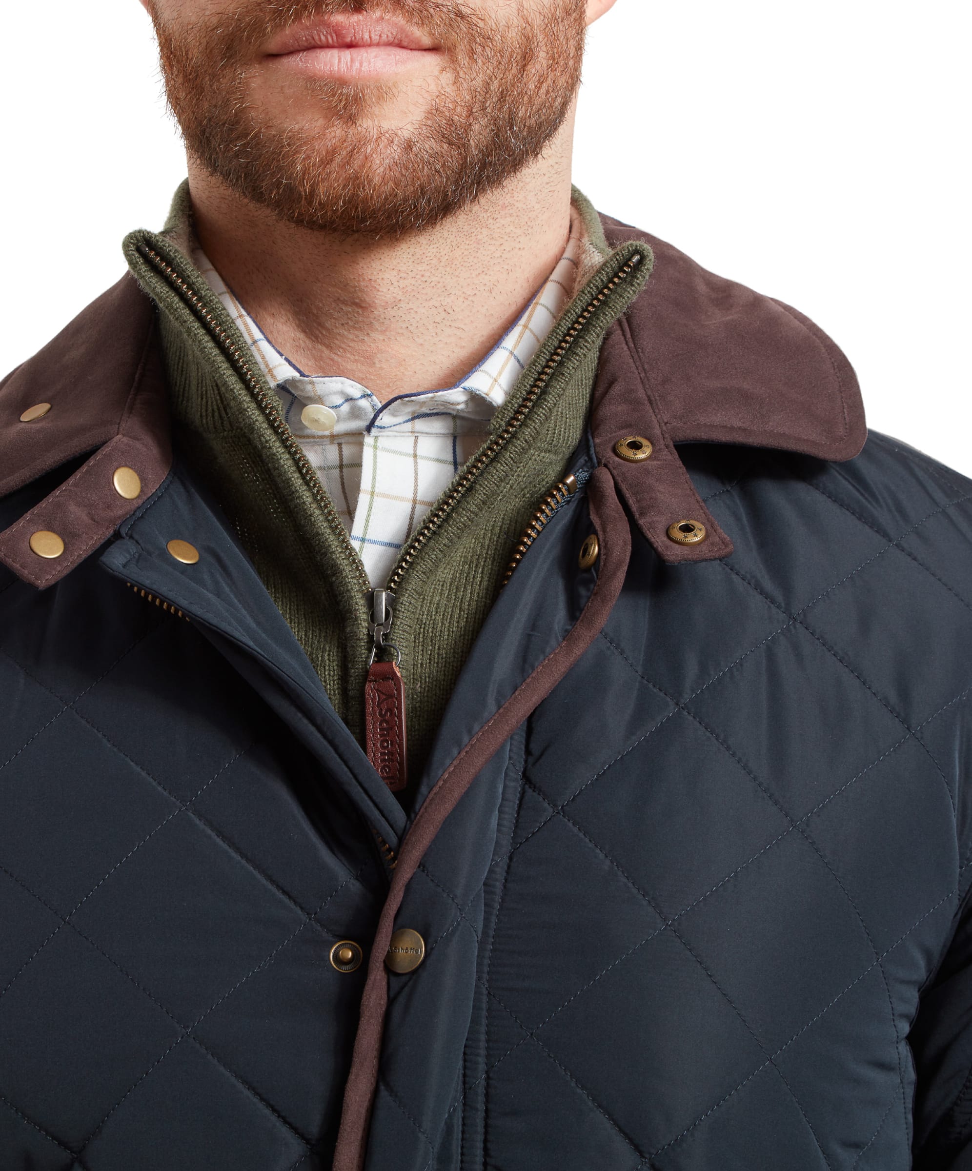 Close-up of the man's face and upper chest, highlighting the collar and zipper of the Schöffel Barrowden Quilt Jacket for Men in Blue.