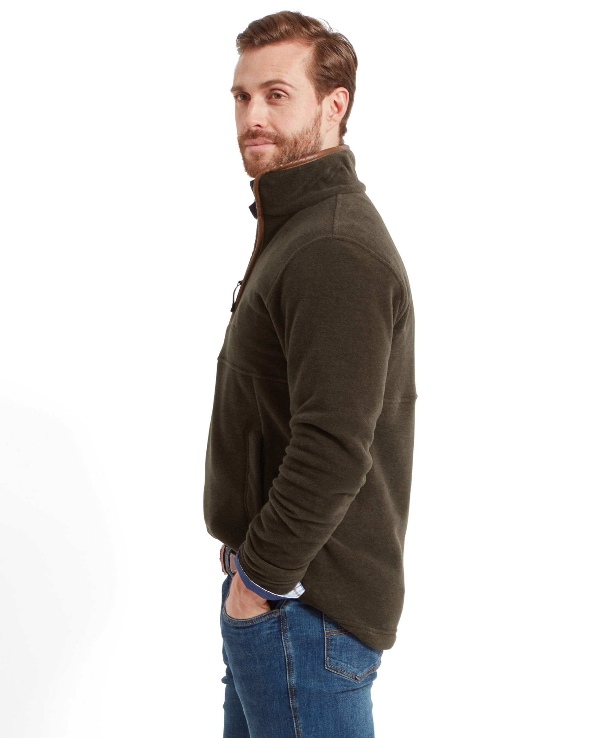 Side profile of man in Schöffel Berkeley Fleece 1/4 Zip Fleece for Men in Olive Green, wearing light blue jeans with his hand in the jean pocket.