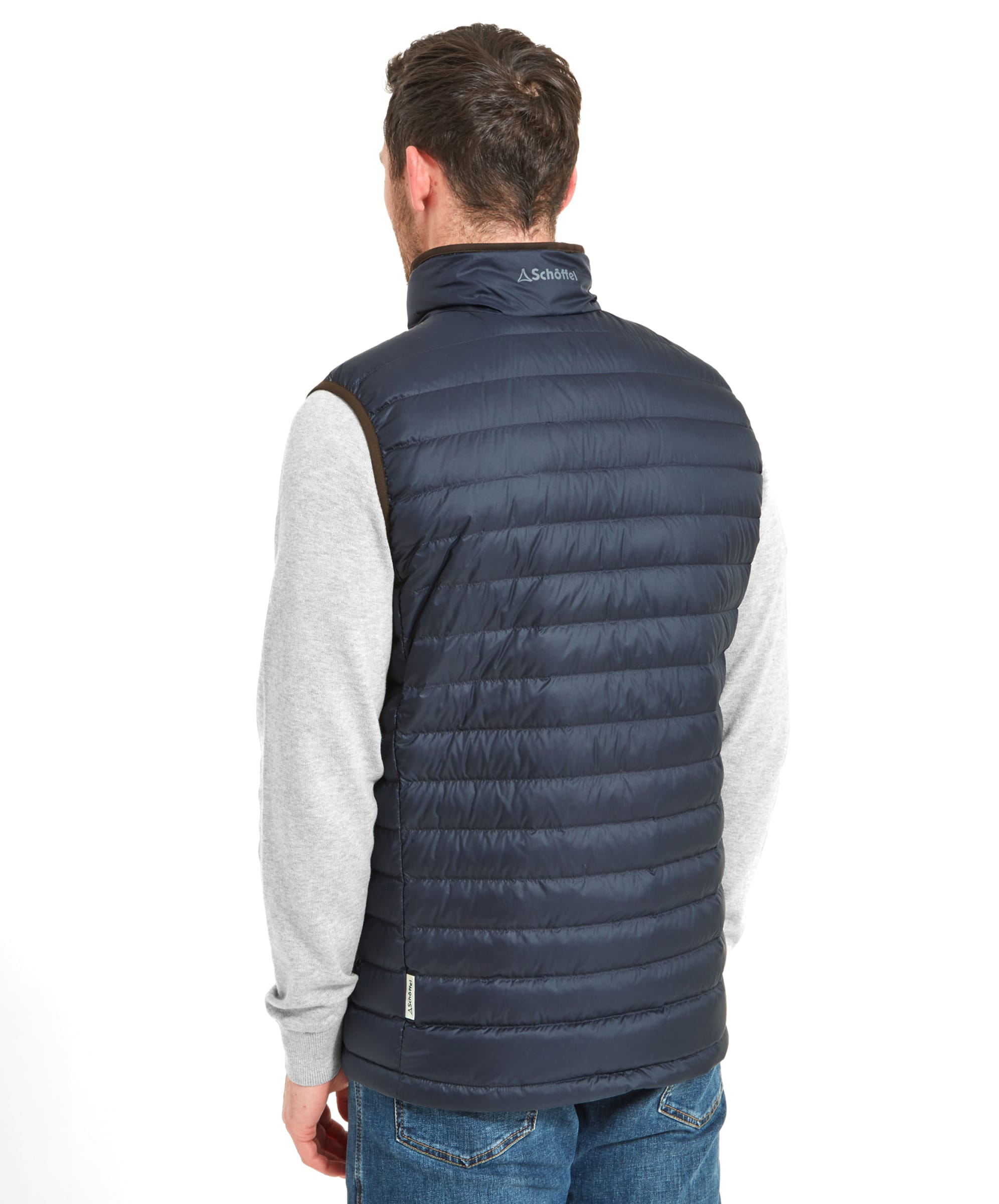 Rear view of a man wearing a Schöffel Bowden Down Gilet for Men in Blue, showing the back details with a grey long-sleeve shirt.