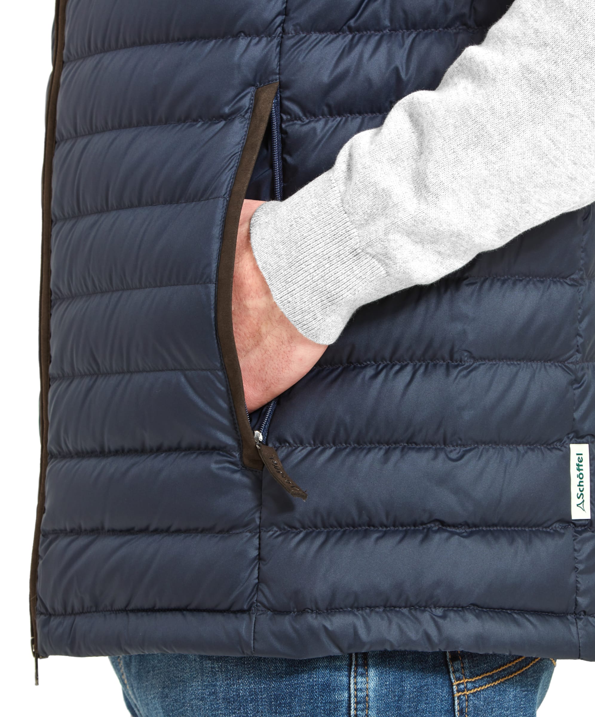 Close-up of a man’s hand in the pocket of a Schöffel Bowden Down Gilet for Men in Blue, showing the pocket's design and material.