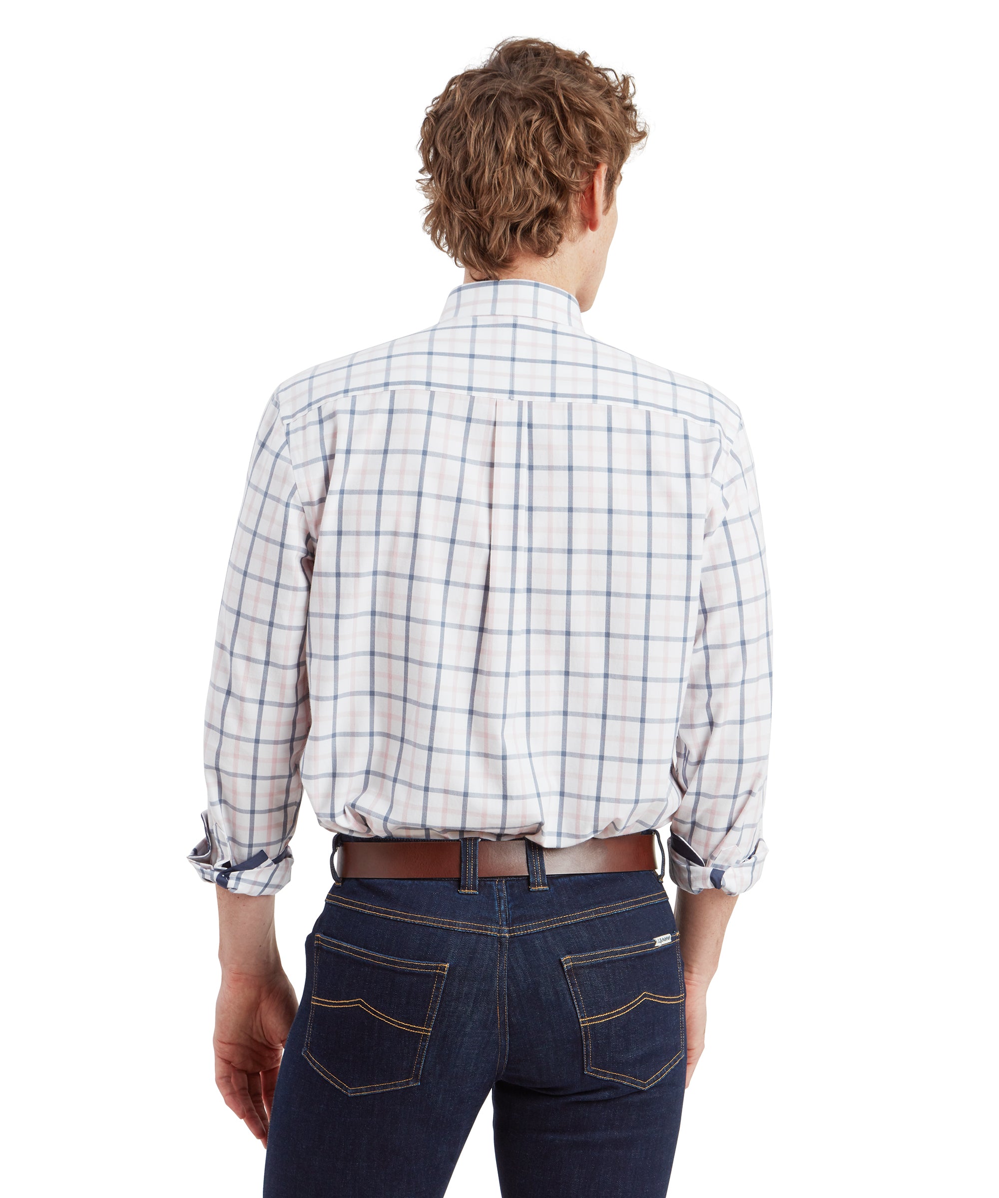 A back view of the man showing the Schöffel Brancaster Classic Shirt for Men in Blue's fit. The shirt is neatly tucked into his dark blue jeans, highlighting the shirt's checkered pattern. The back pleat of the shirt is visible, providing a comfortable fit.