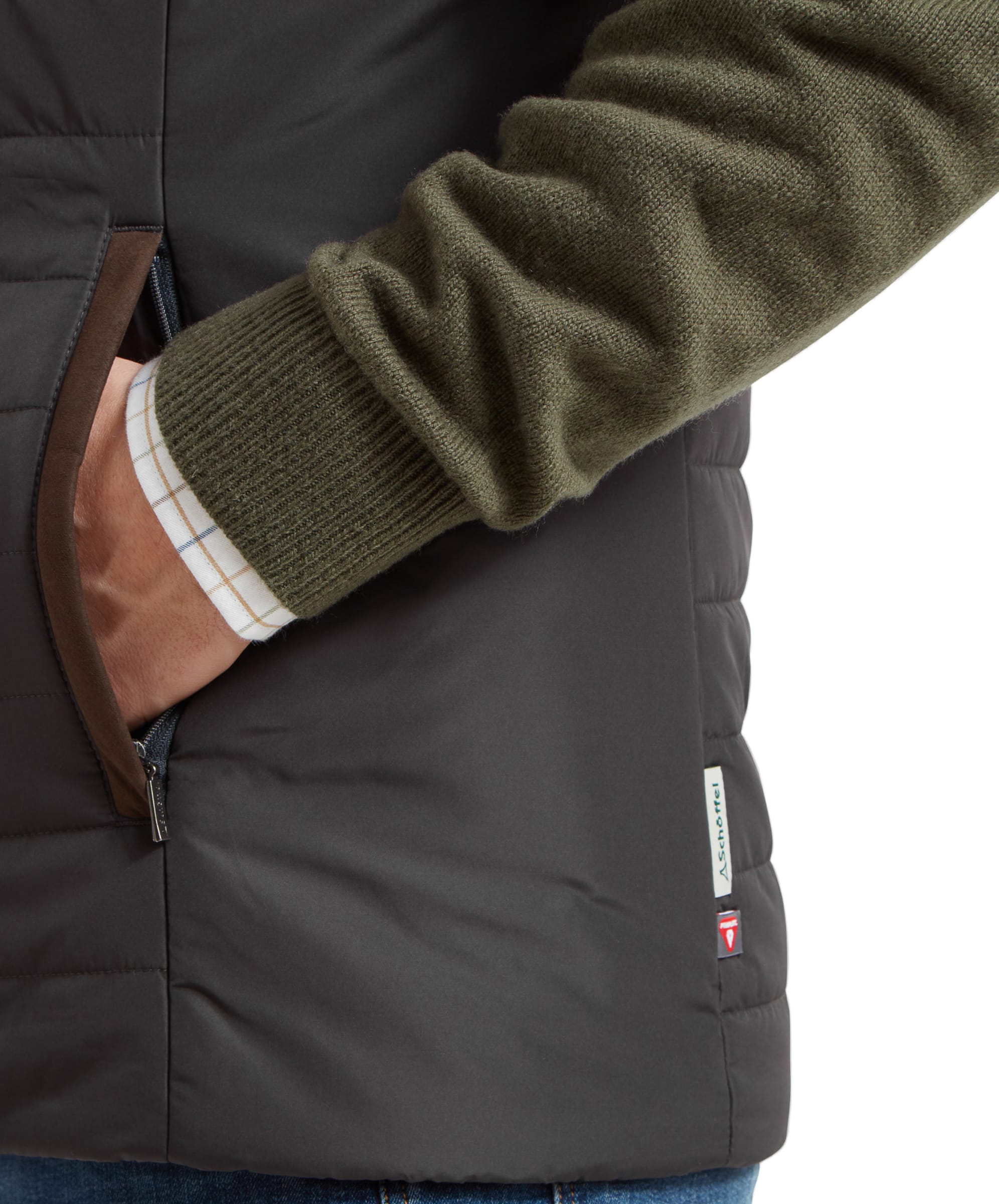 A close-up of the side pocket, highlighting the zippered opening and the subtle Schöffel branding, demonstrating the Schöffel Brora Gilet for Men in Grey's functional design elements.