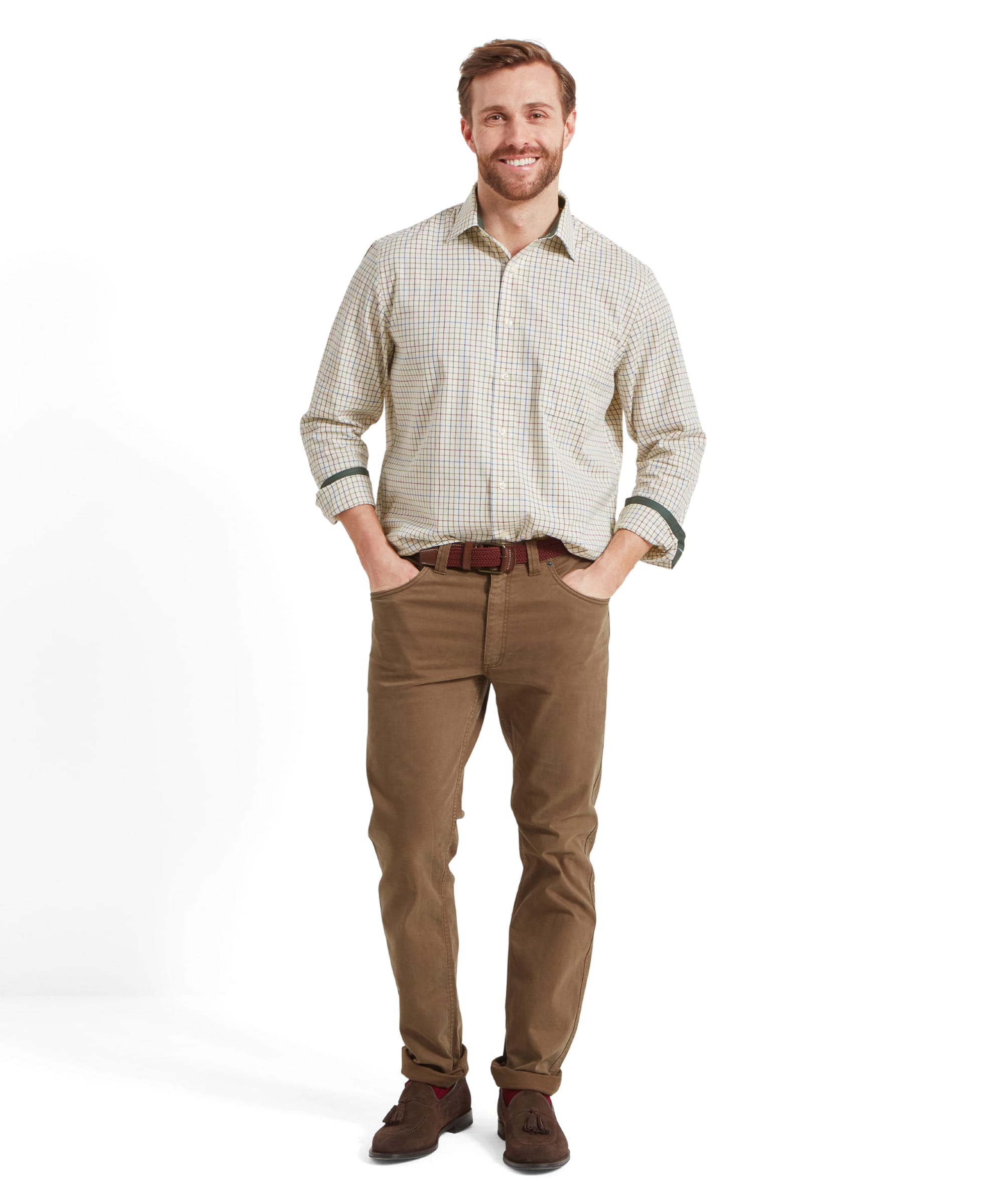 Full-body shot of man in Schöffel Burnham Tattersall Classic Shirt in Green, hands in pockets.