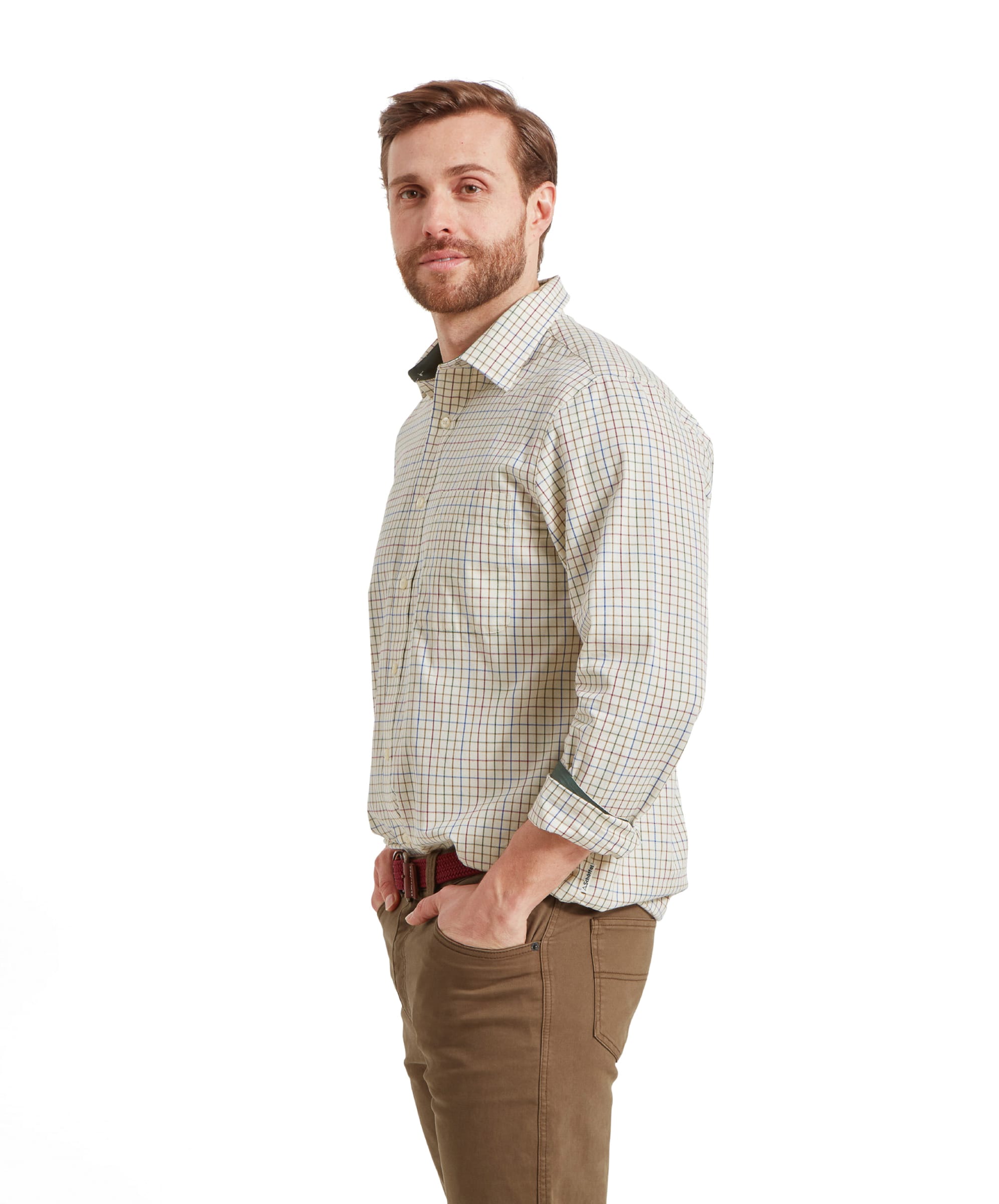 Side view of man in Schöffel Burnham Tattersall Classic Shirt in Green, hands in pockets