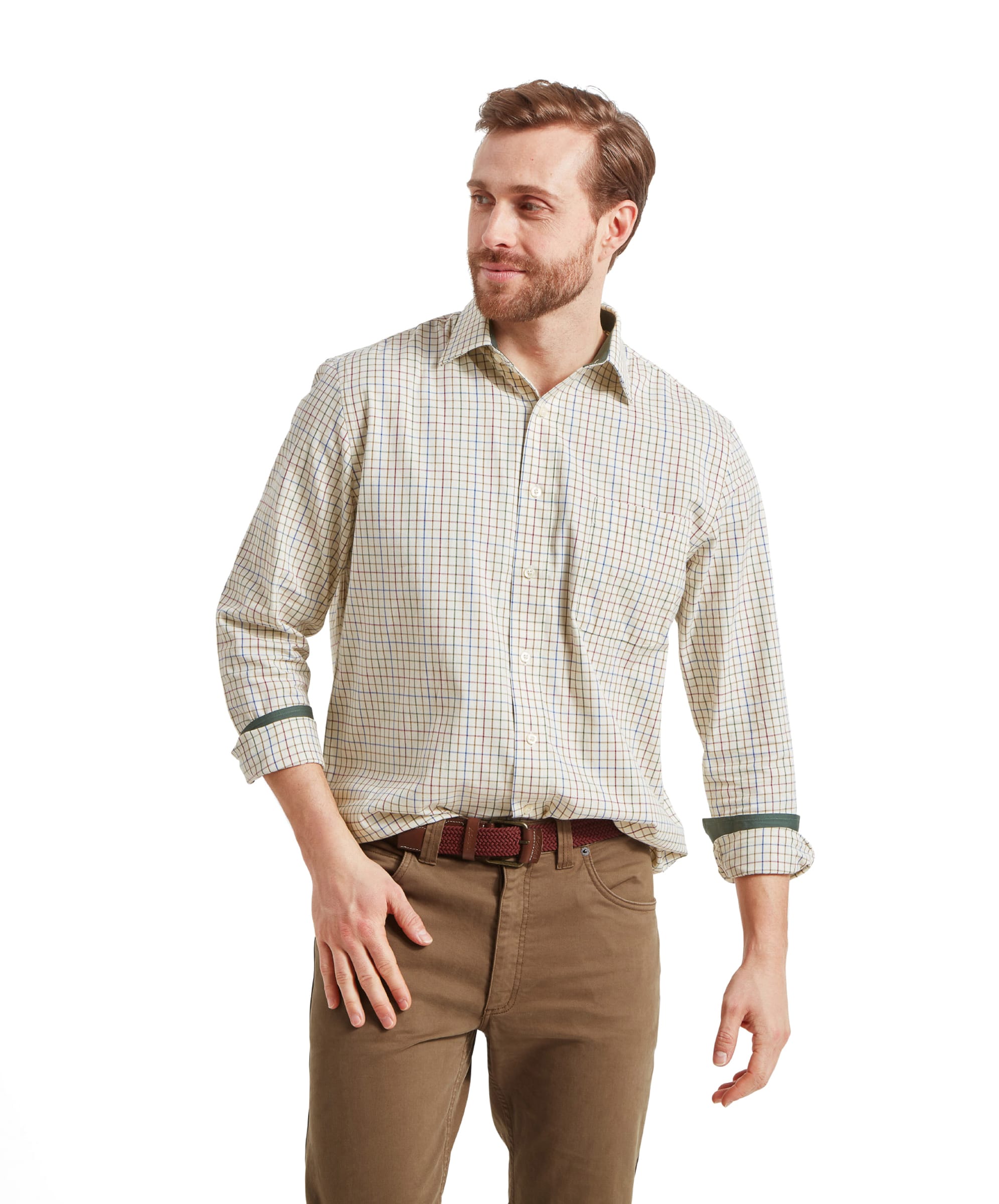 Man in Schöffel Burnham Tattersall Classic Shirt in Green, smiling, hand on hip.