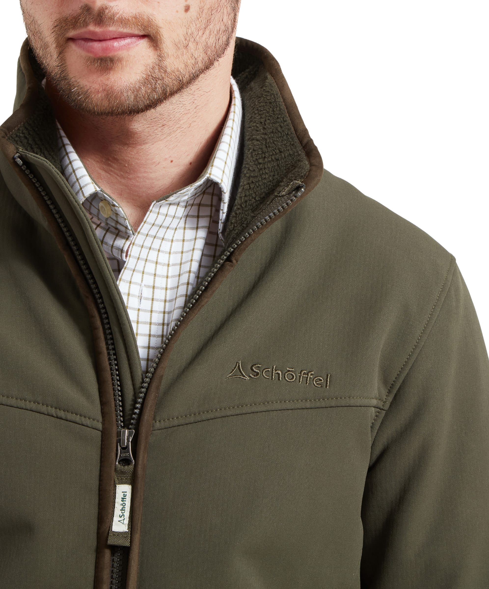 Close-up of the chest area of the Schöffel Men's Burrough Jacket in Green, featuring the Schöffel logo and zipper details.