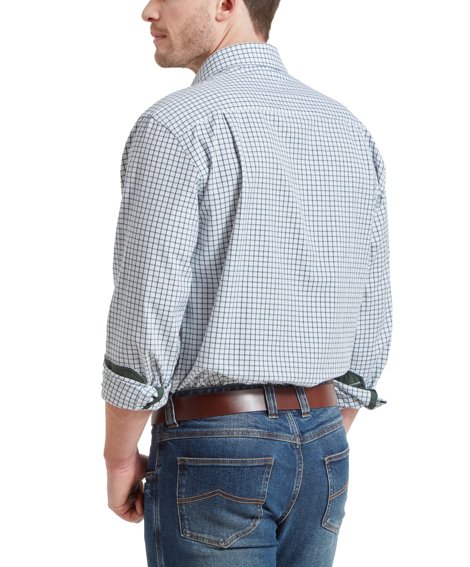 Back view of the man wearing the Schöffel Cambridge Classic Shirt for Men in Green, with the sleeves rolled up, showing the shirt's detail from behind.