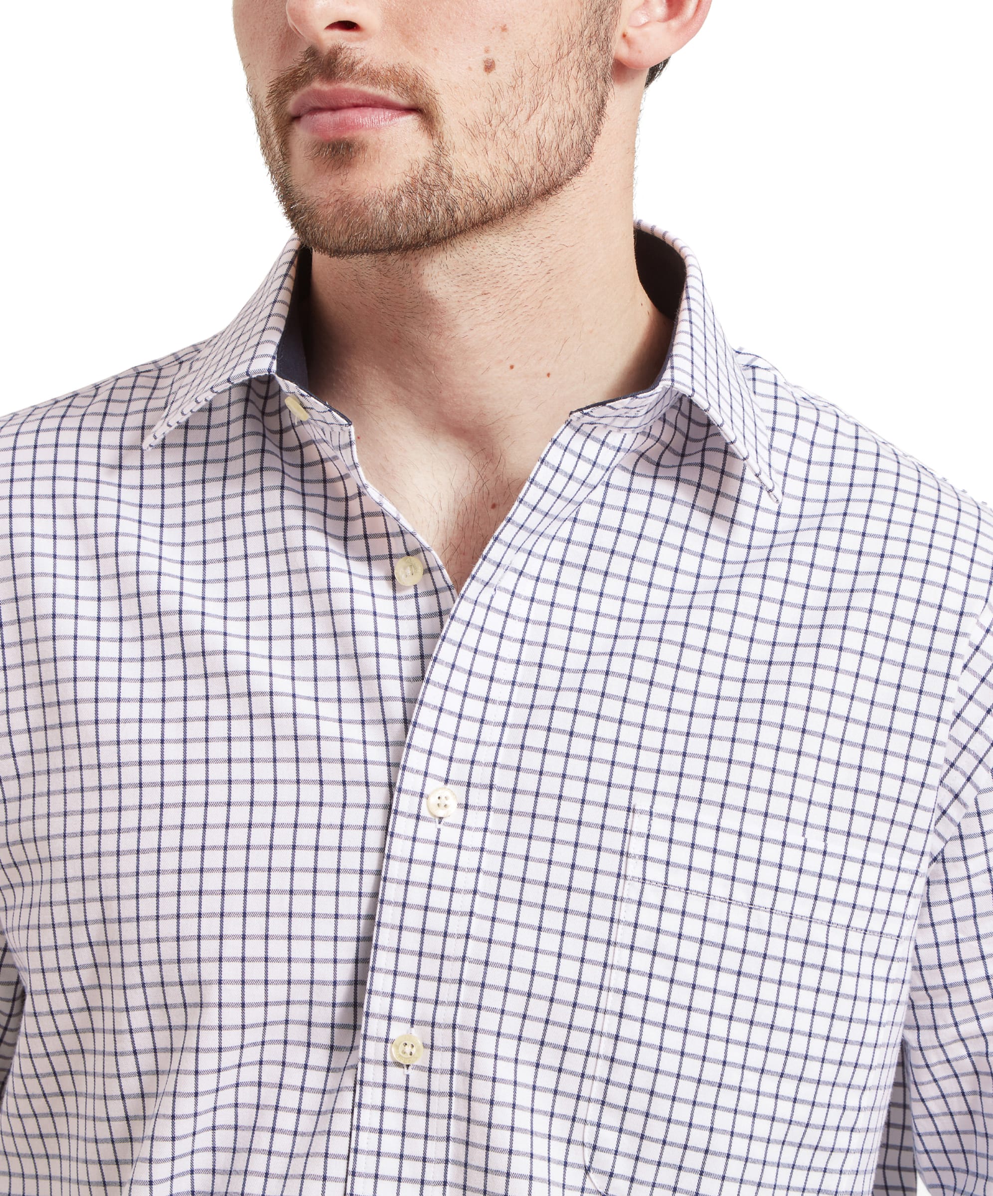 Close-up of the shirt's cuff, with the model slightly lifting his sleeve to reveal the details of the Schöffel Cambridge Classic Shirt for Men in Navy.