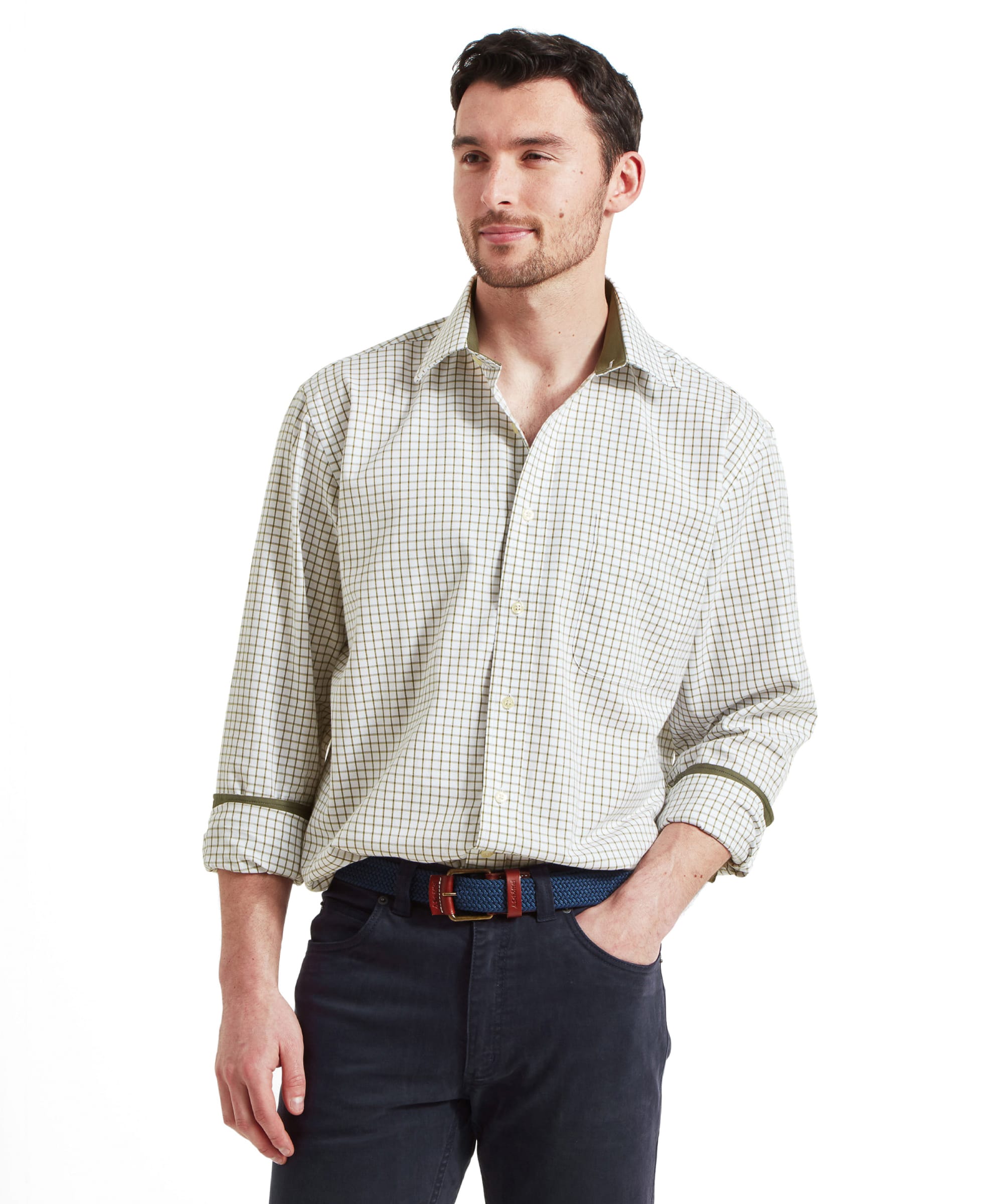 A man wearing the Schöffel Cambridge Classic Shirt for Men in Green, with a confident look and hands in pockets.