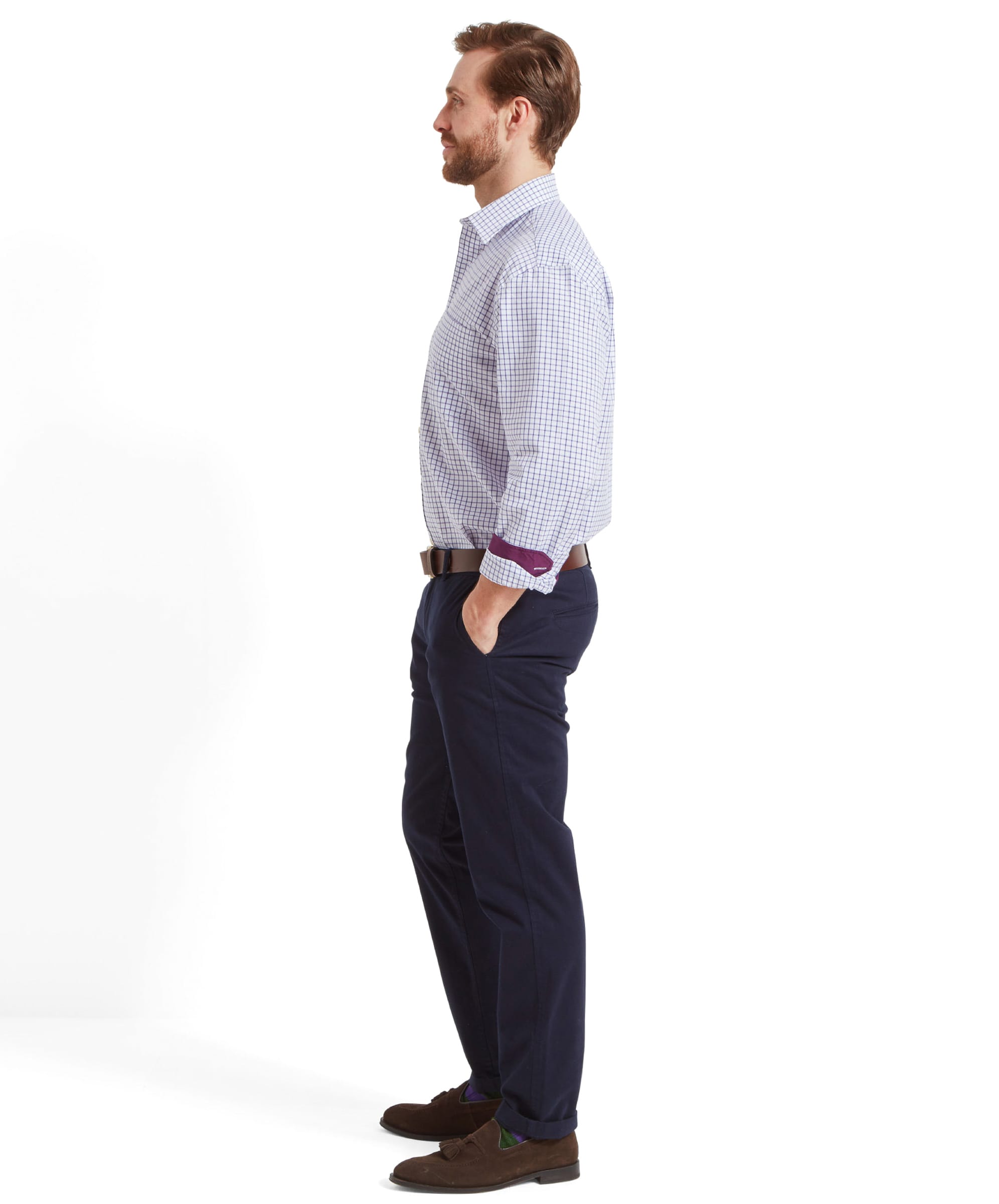 The man is captured from the side, hands in pockets, highlighting the Schöffel Cambridge Classic Shirt for Men in Purple's fit and cut from a side profile.