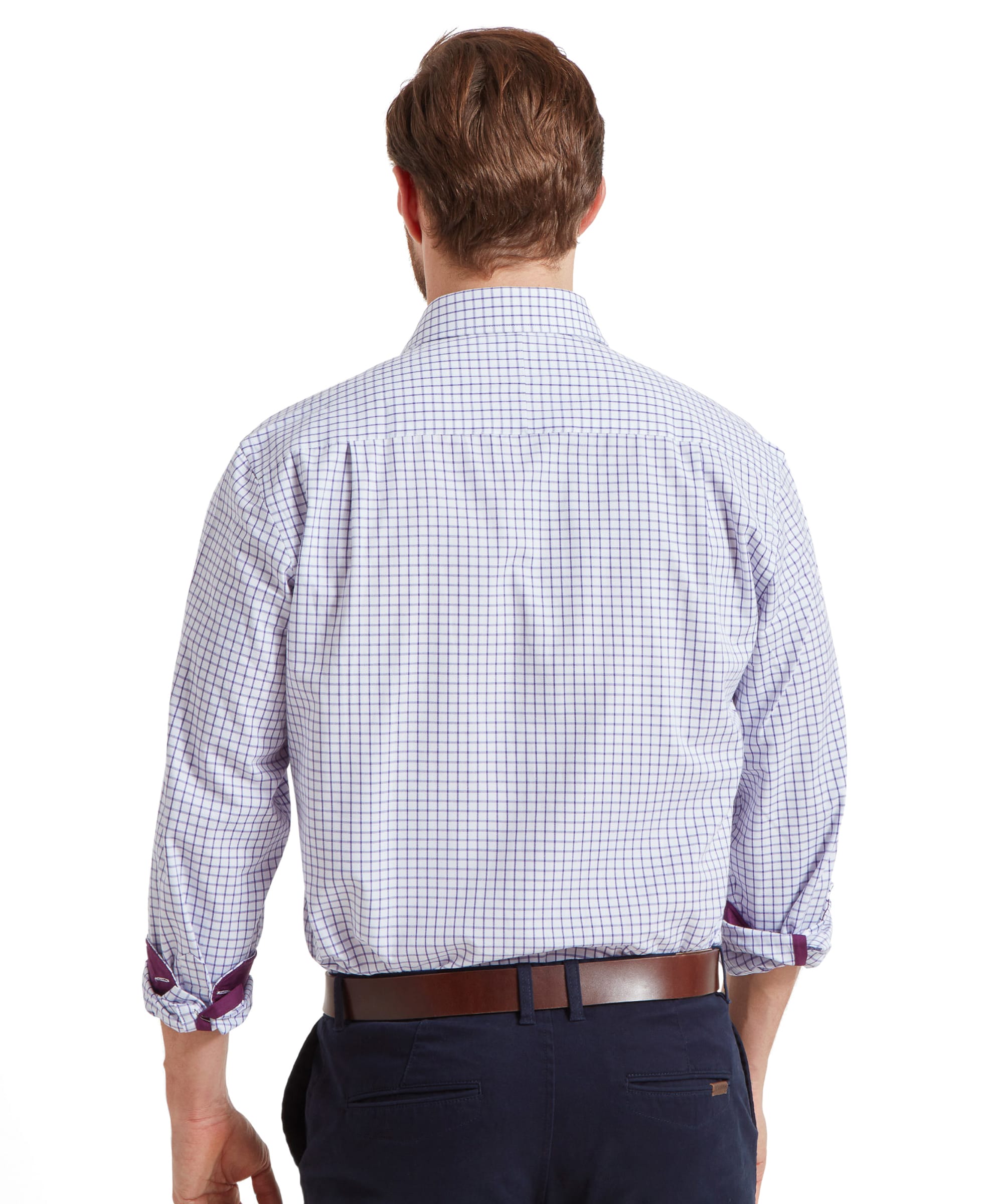 The man is shown from the back, hands in pockets, displaying the back design and fit of the Schöffel Cambridge Classic Shirt for Men in Purple.