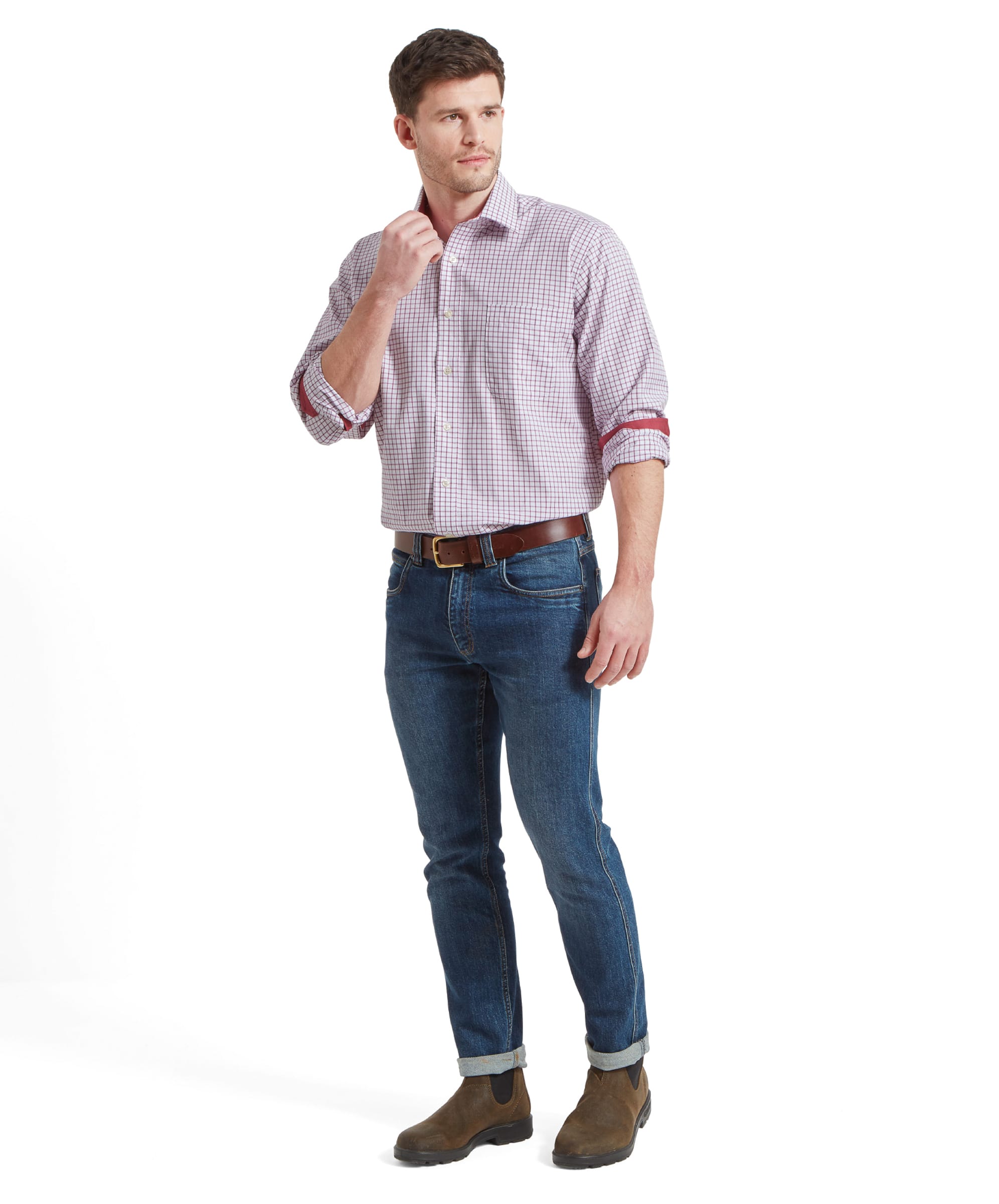 Full-body view of a model wearing the Schöffel Cambridge Classic Shirt for Men in Red, paired with jeans and boots, demonstrating a casual yet sophisticated look.