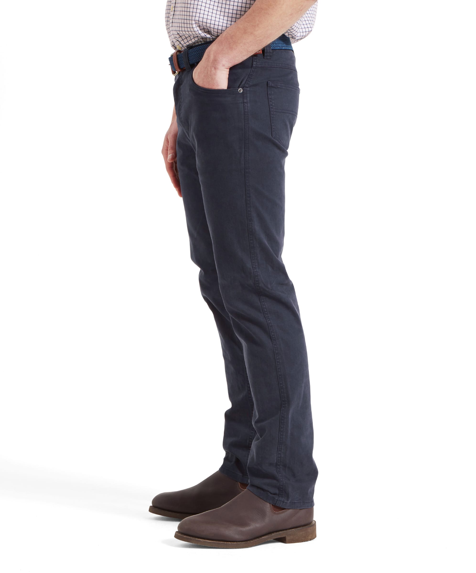 Side view of the model in the Schöffel Canterbury 5 Pocket Jean for Men in Navy, showing the fit and pockets.