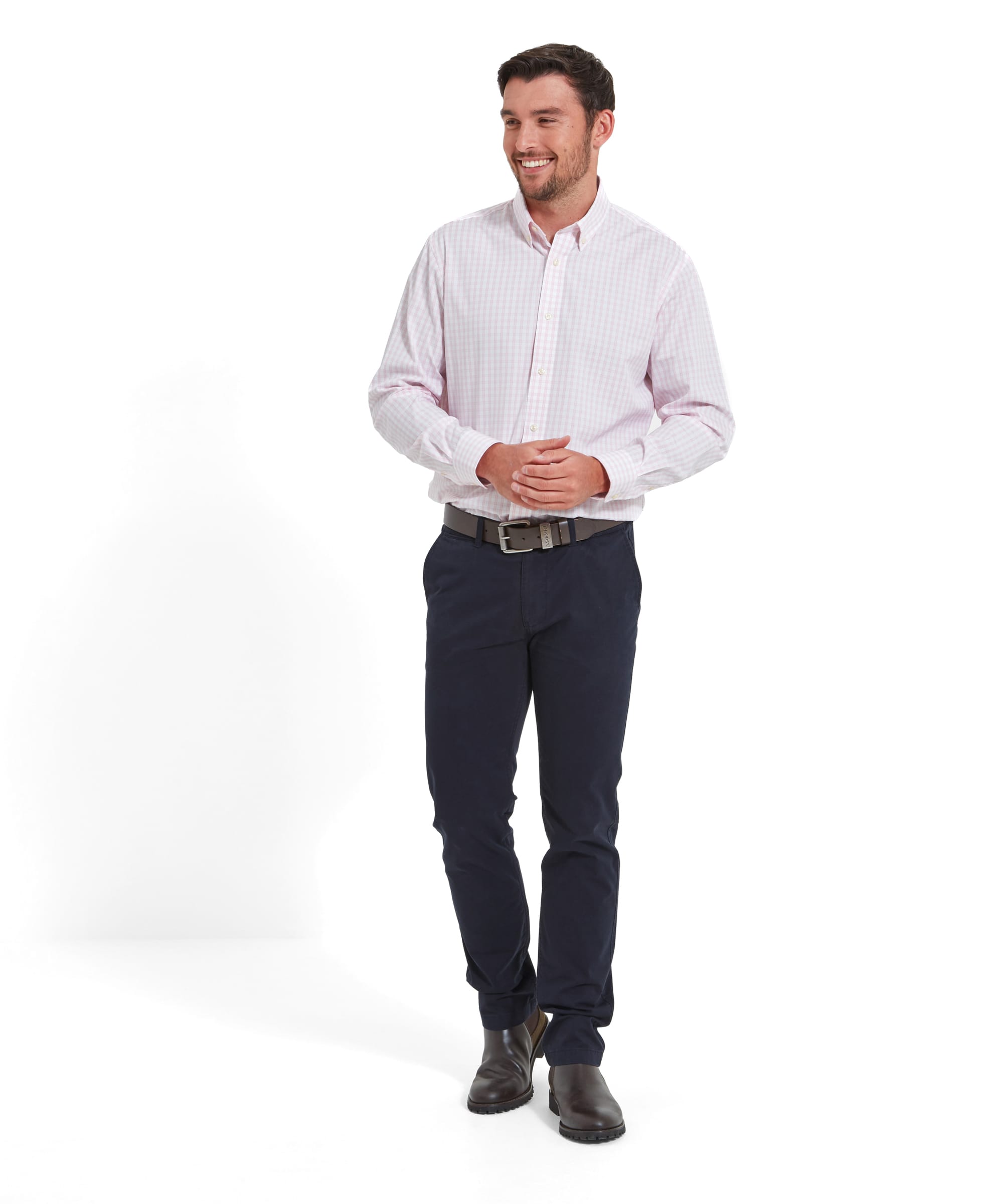 A full-body shot of a man wearing the Schöffel Chichester Chino in Navy, paired with a checked shirt and brown shoes.