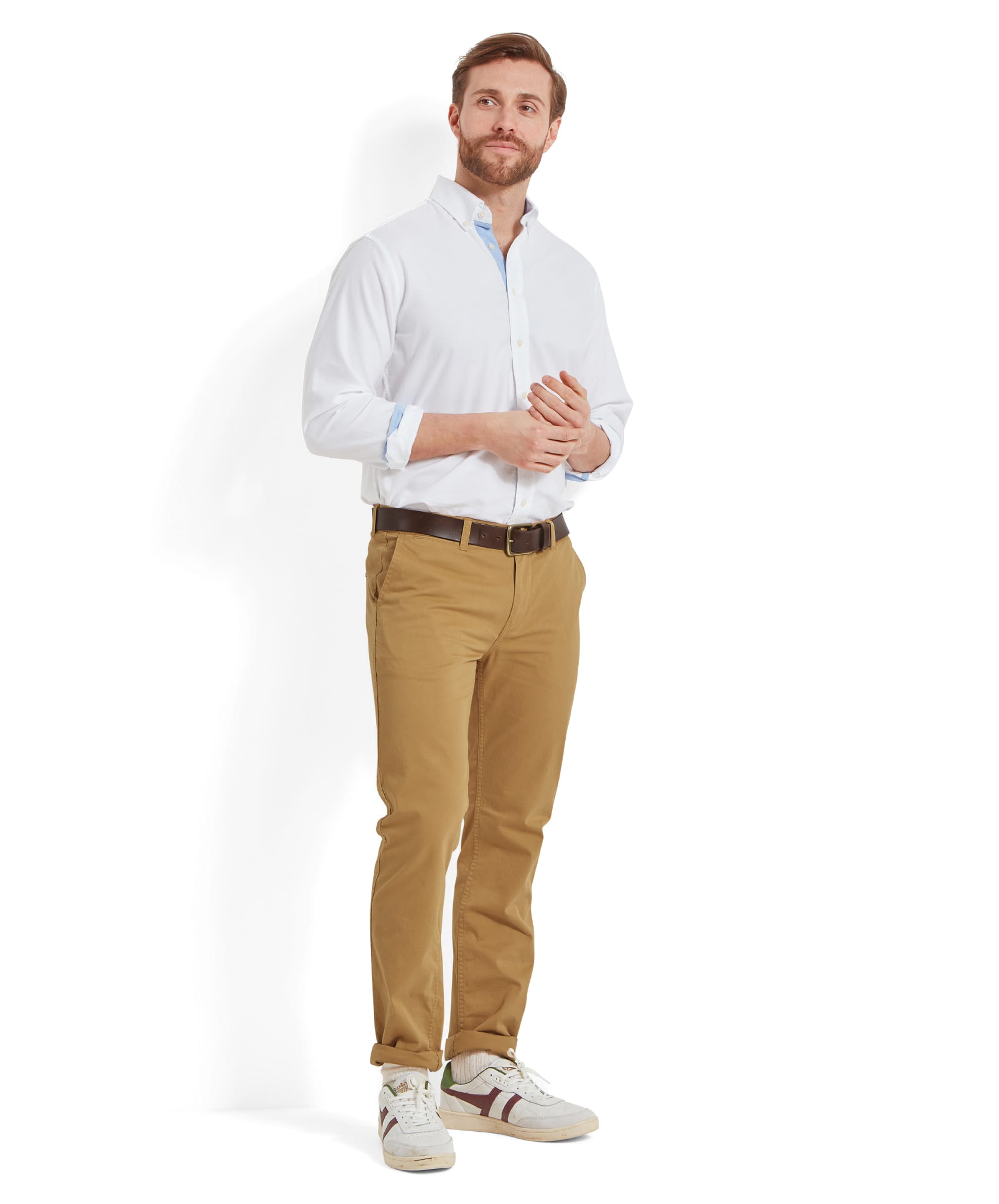 Full-body view of the model in Schöffel Chichester Chino in yellow, styled with a white shirt for a clean, summery outfit.