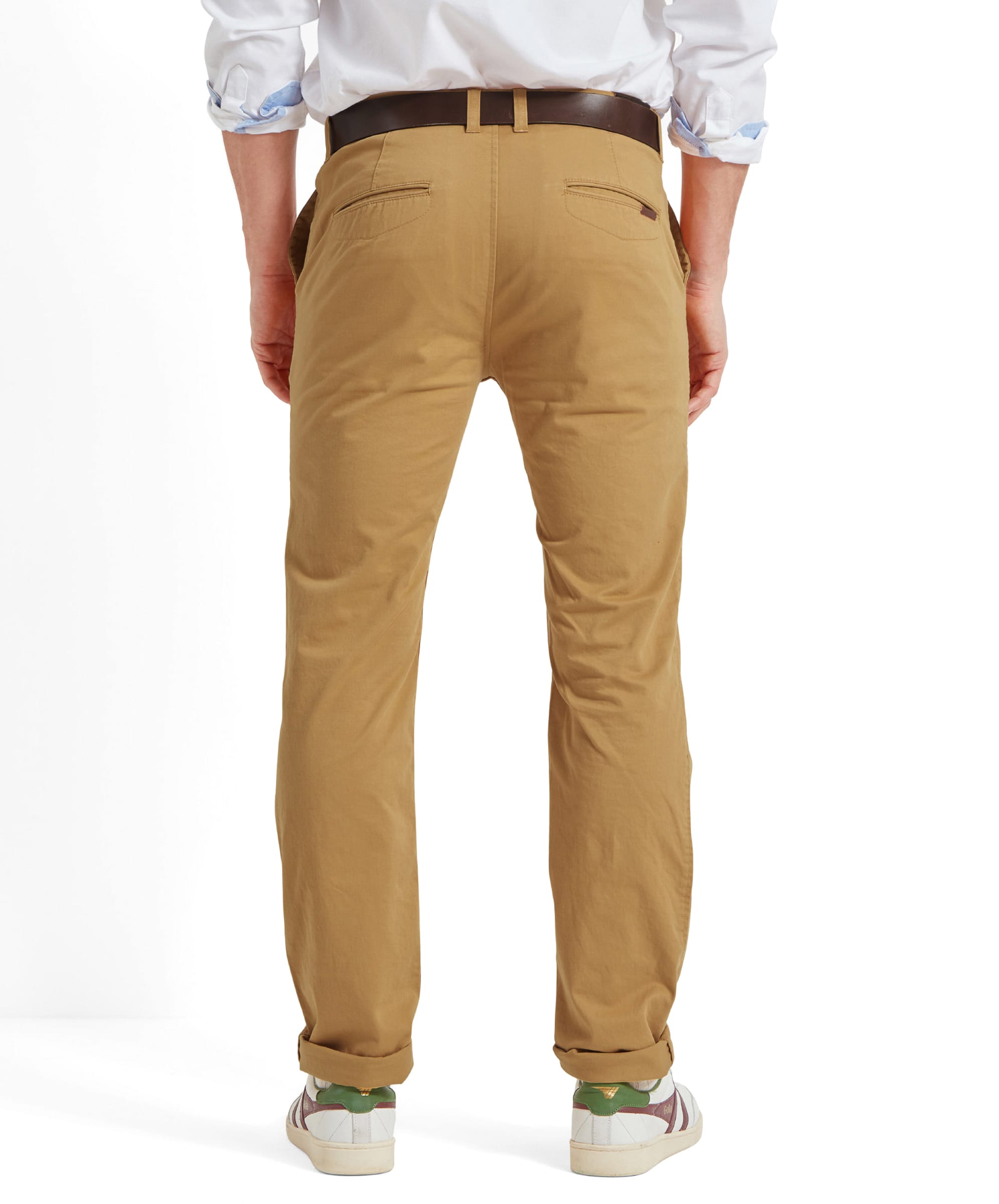 Rear view of the model displaying the back pockets and design of the Schöffel Chichester Chino in yellow.