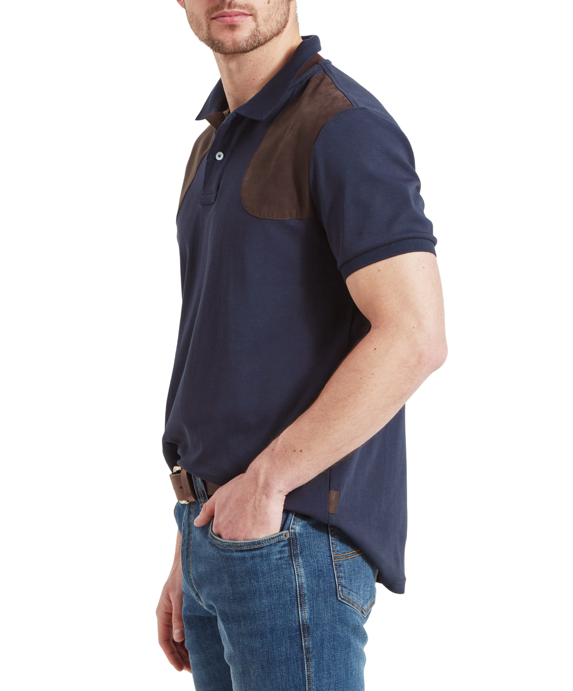 Side profile of a man wearing a Schöffel Cordoba Polo Shirt for Men in Navy with brown shoulder patches and blue jeans.