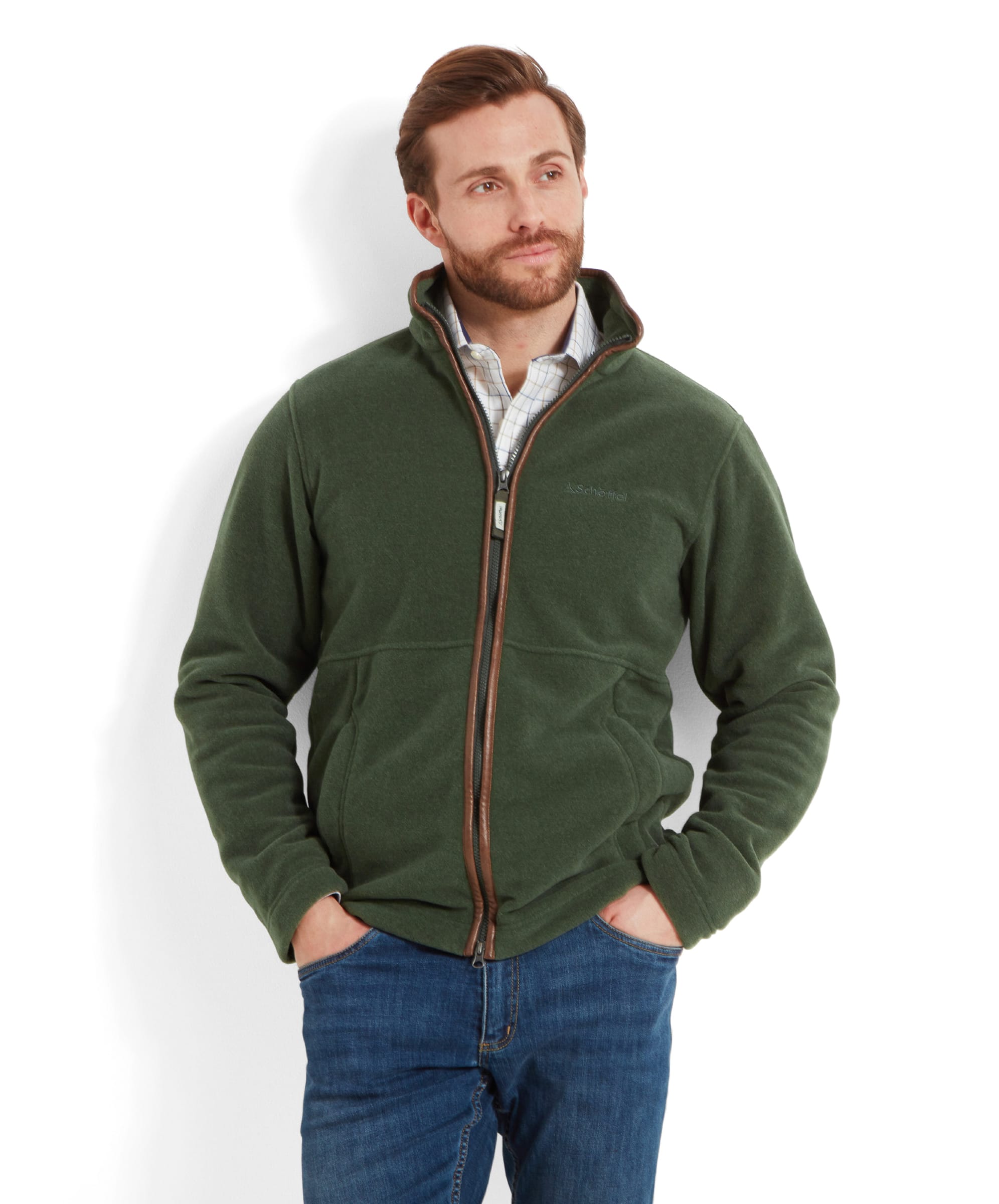 Model standing with hands in pockets, showcasing the Schöffel Cottesmore Fleece Jacket for Men in Green's front design.