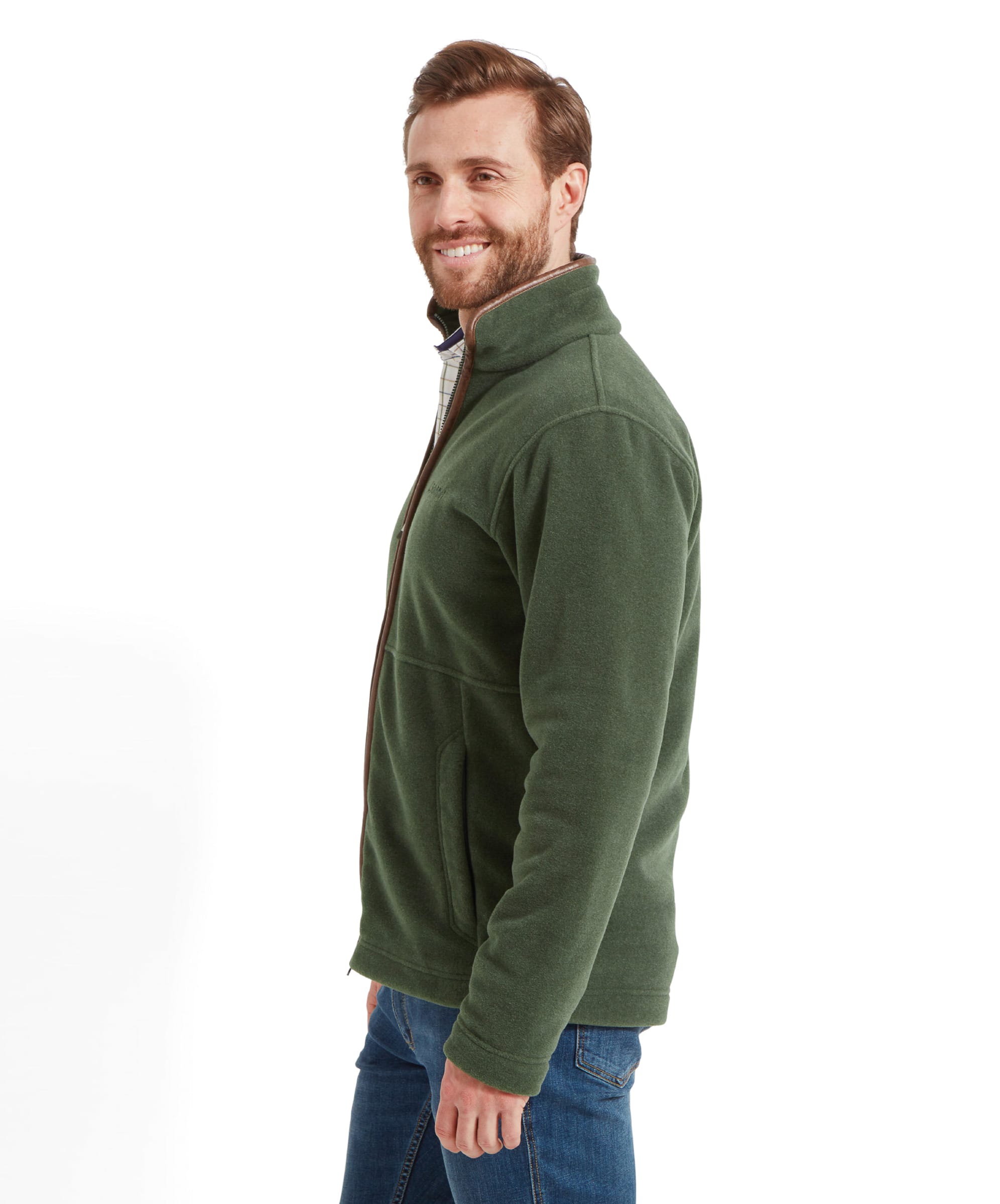 Side profile of the model smiling, showing the Schöffel Cottesmore Fleece Jacket for Men in Green's side view.