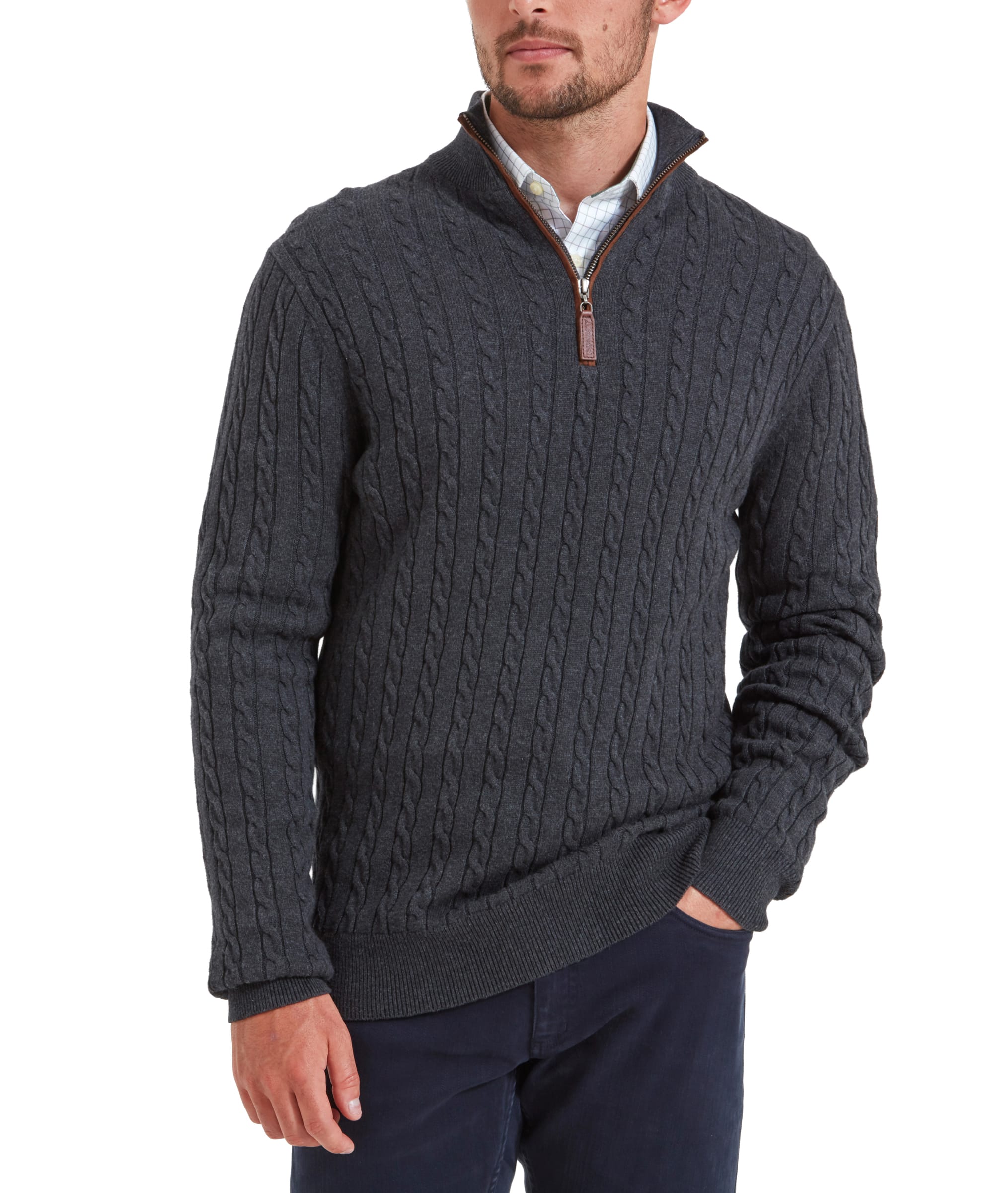 A man modeling the Schöffel Cotton Cashmere Cable 1/4 Zip Jumper for Men in Grey. He stands with his hands in his pockets, displaying the front of the jumper.