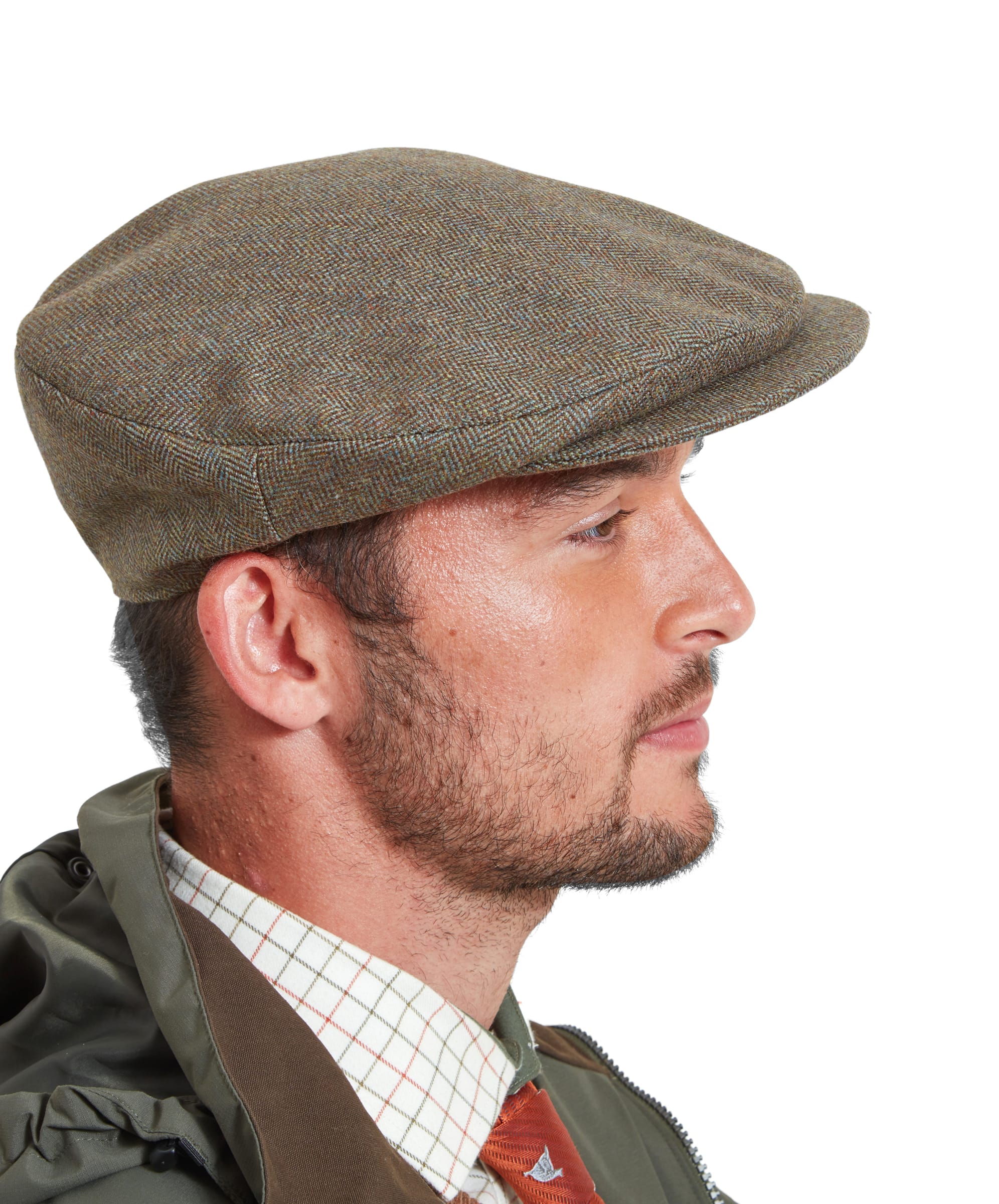 Side view of a man wearing the Schöffel Countryman Tweed Cap for Men in Green. The cap features a classic tweed pattern, and the model is dressed in a checkered shirt, orange tie, and green jacket.