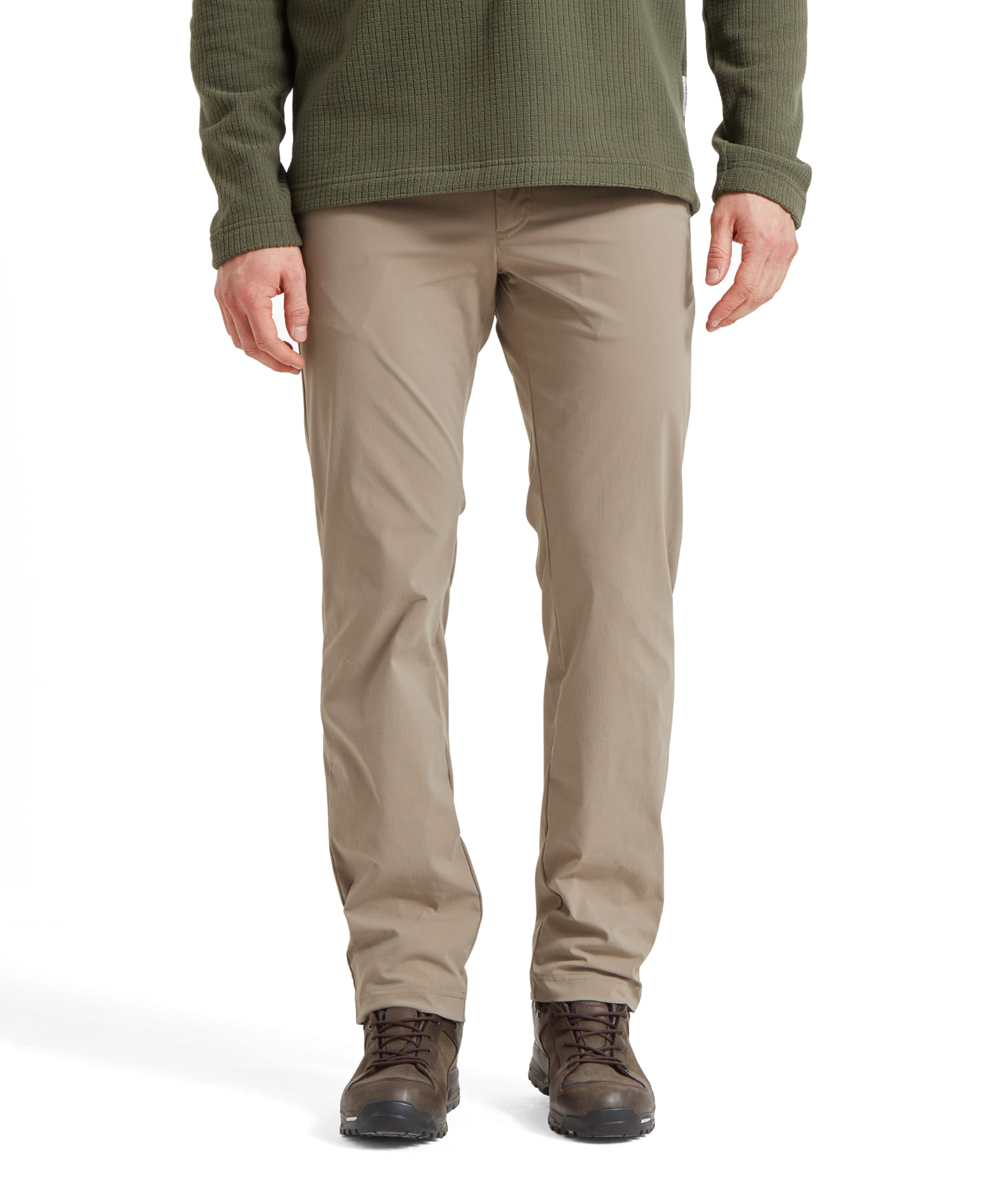 Front view of a man wearing Schöffel Men's Deveron Fly Fishing Trousers in Light Brown, paired with a green pullover and brown hiking boots.