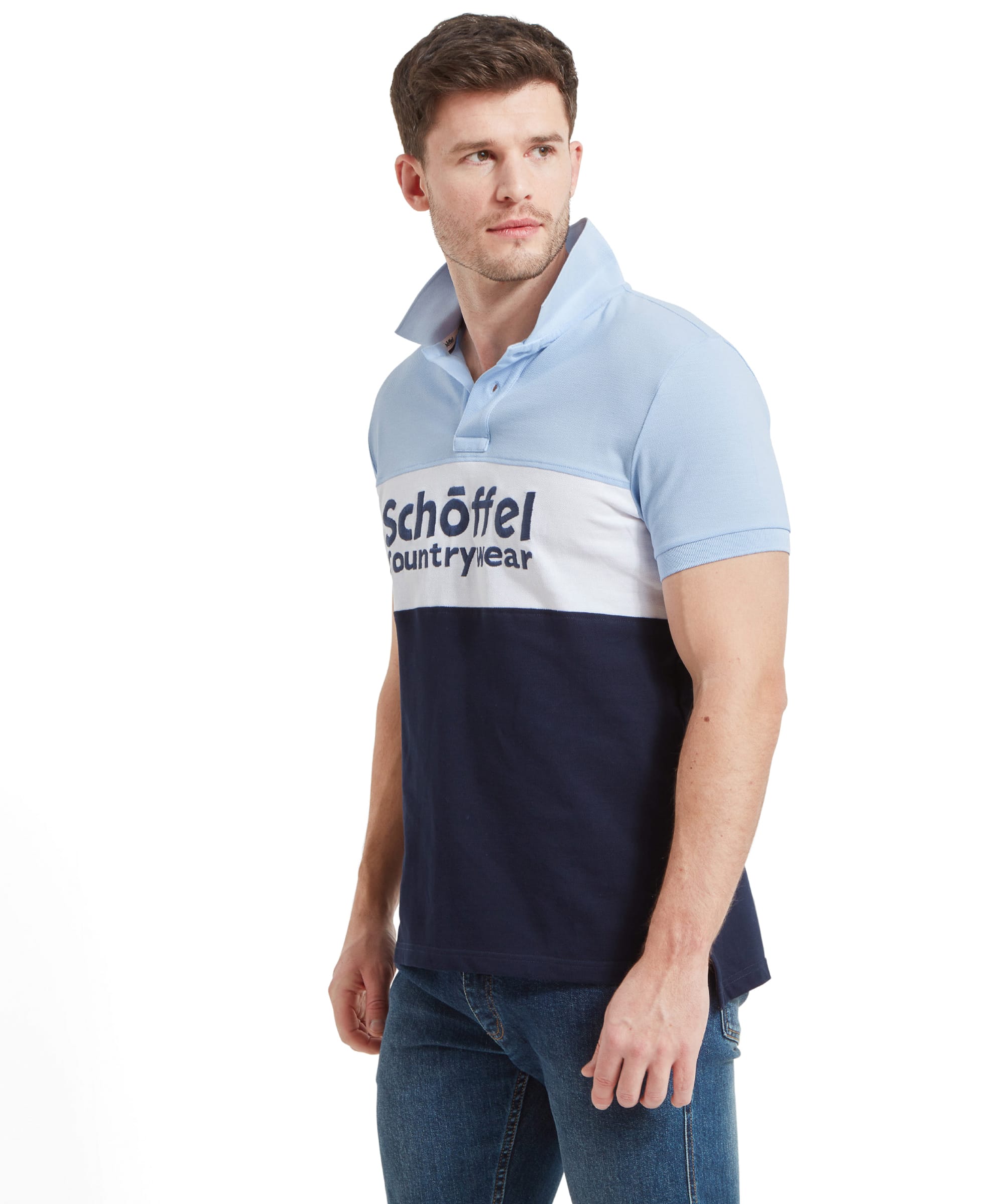 Side view of the man standing and looking to the side, wearing the Schöffel Men's Exeter Heritage Polo Shirt in Blue.