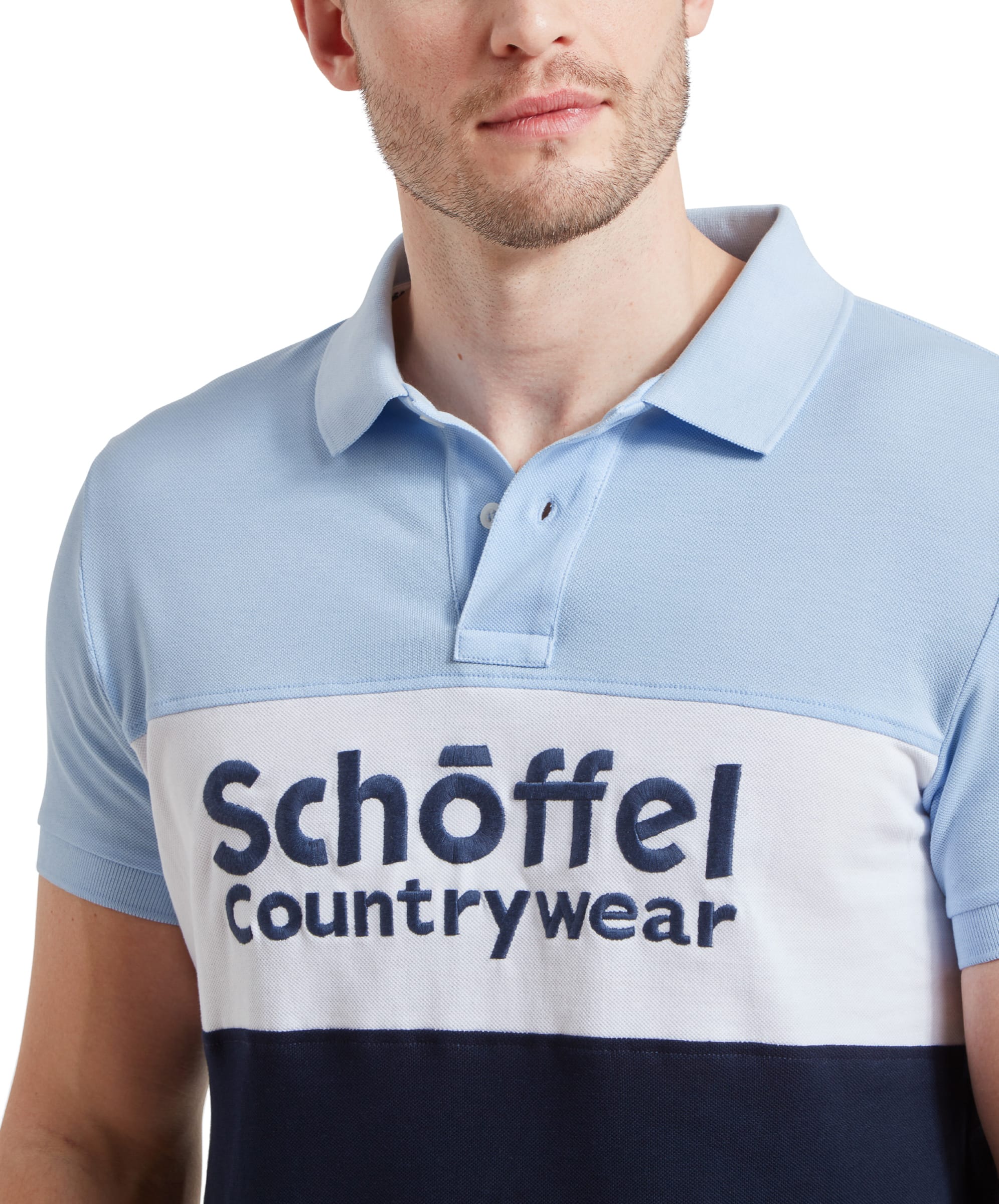 Close-up of the Schöffel Men's Exeter Heritage Polo Shirt in Blue, highlighting the "Schöffel Countrywear" logo on the chest.