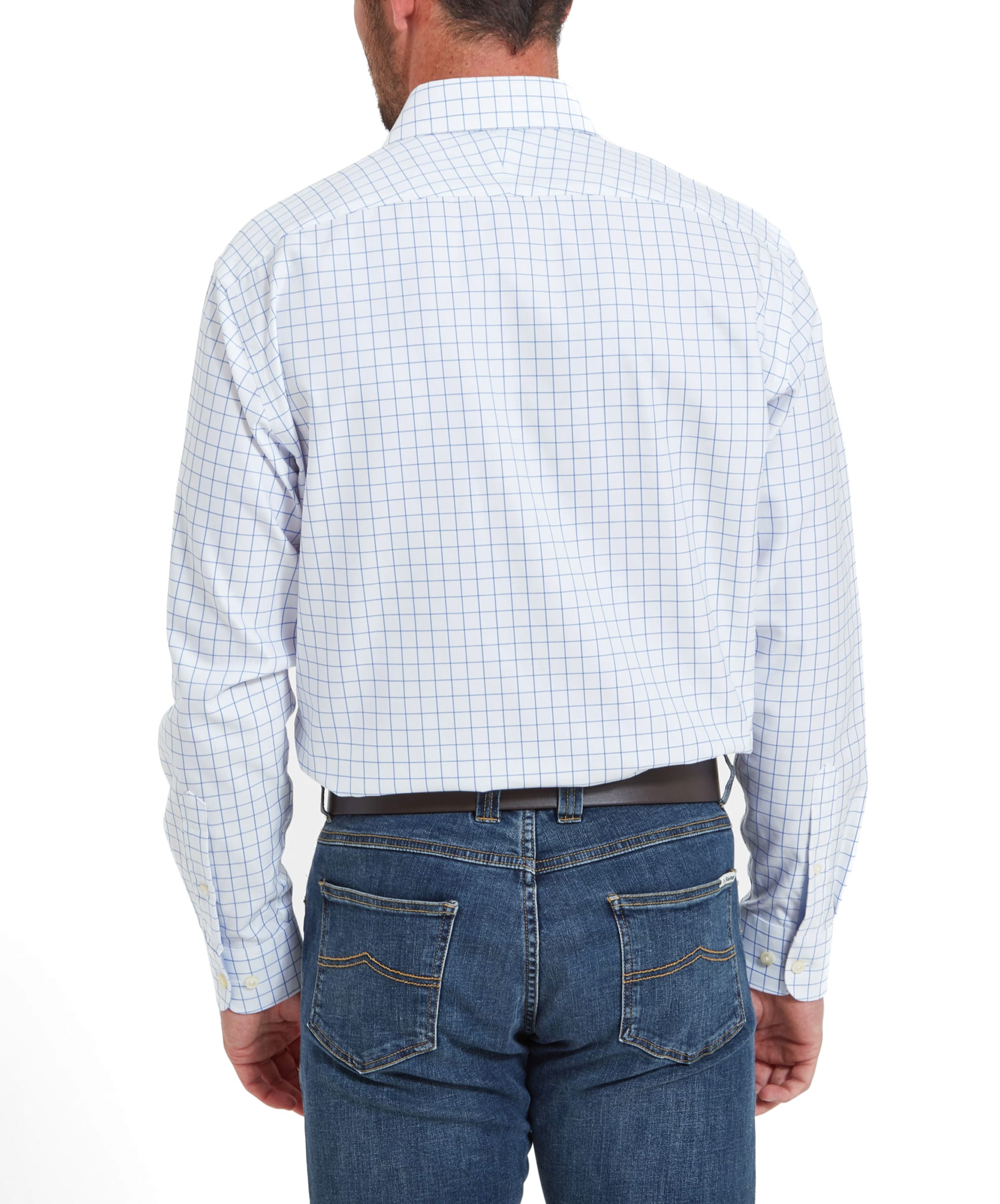 The man is shown from the back, with the Schoffel Greenwich Tailored Shirt for Men in Blue Check of the shirt visible. He is wearing blue jeans and has his hands in his pockets.