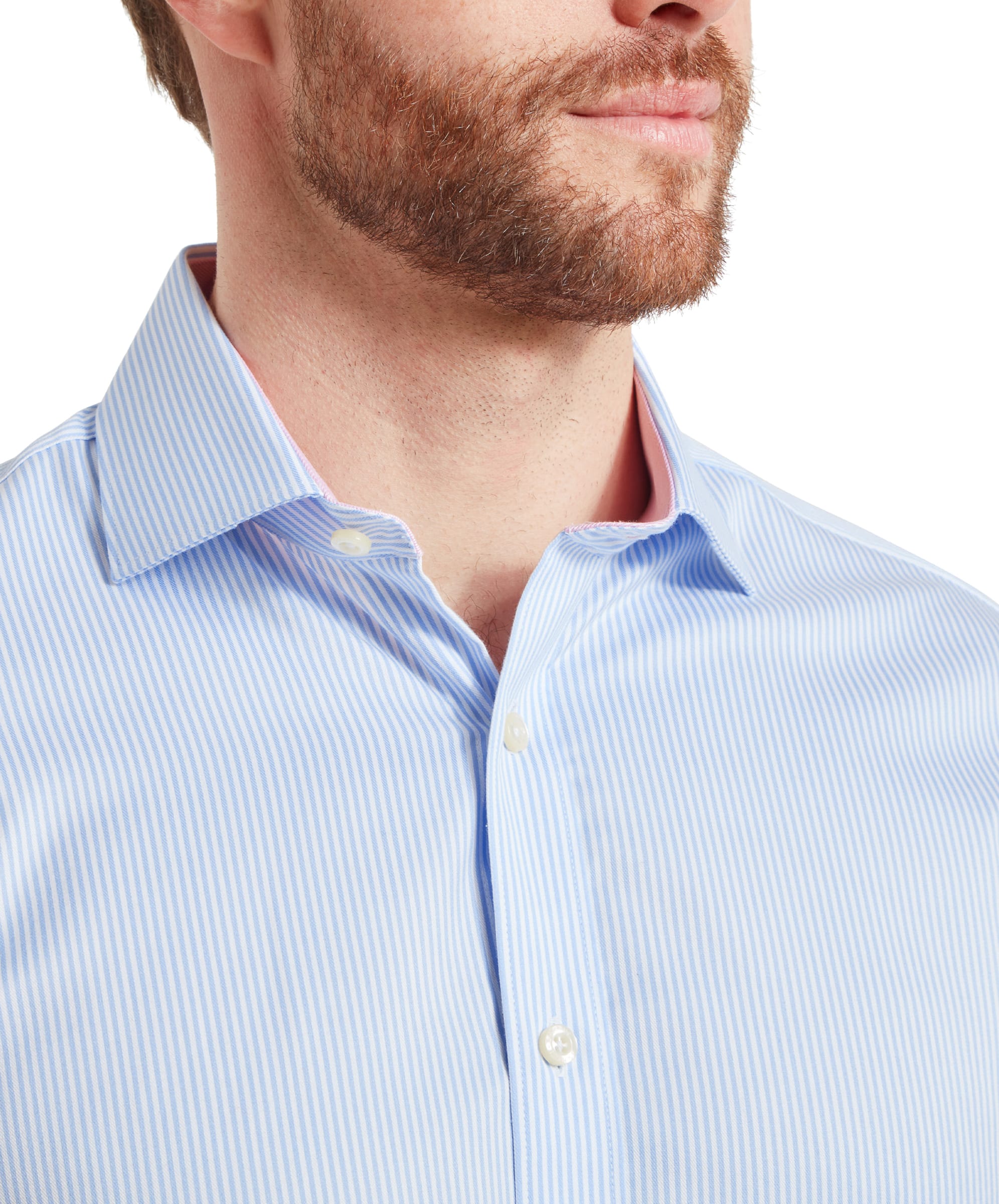 A close-up of a man wearing a Schöffel Greenwich Tailored Shirt for Men in Blue Stripe, focusing on the collar and the upper chest area, with the pink lining on the inner collar visible.