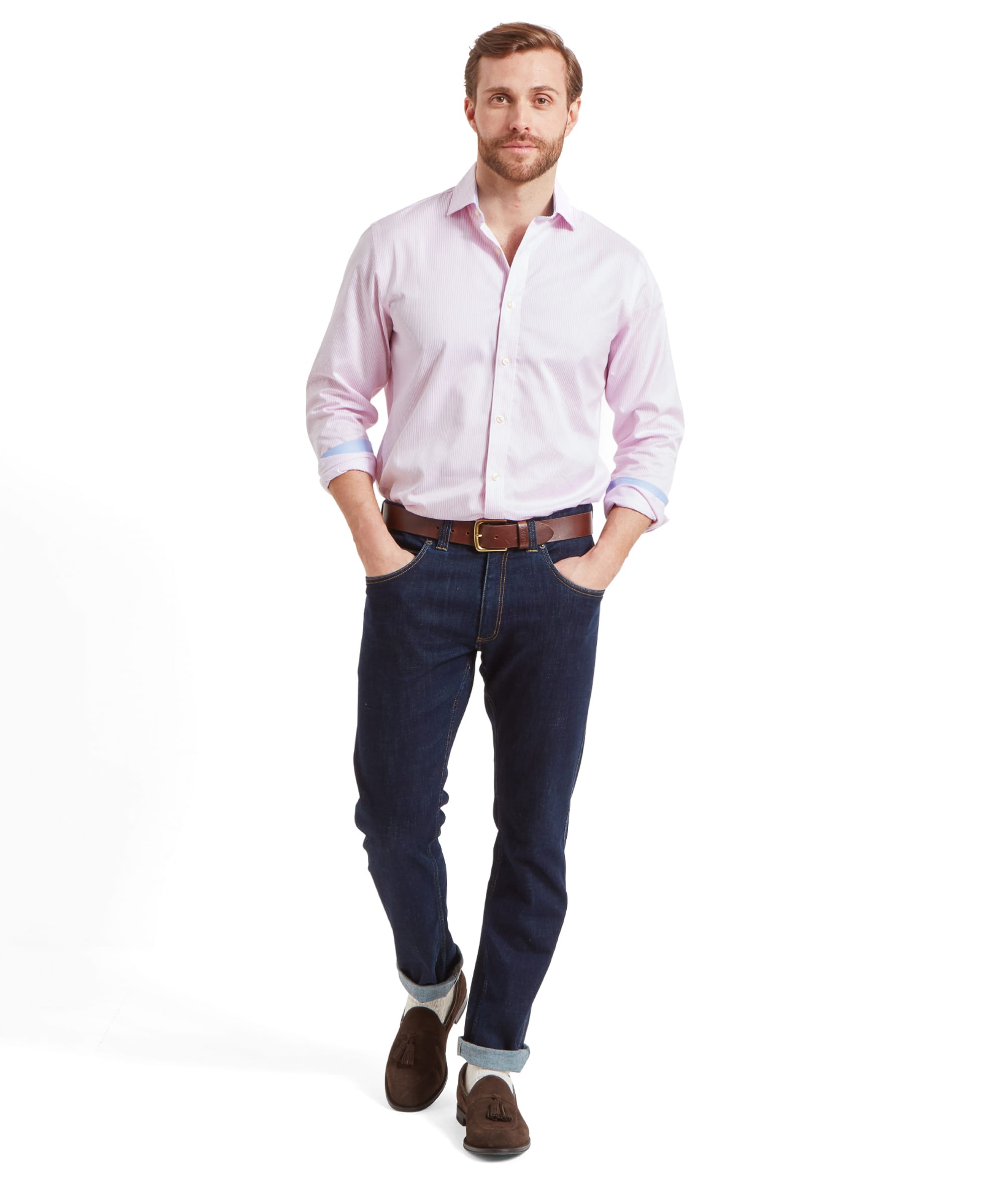 Full body shot of a man wearing the Schöffel Greenwich Tailored Shirt for Men in Pink Stripe, with hands in pockets.