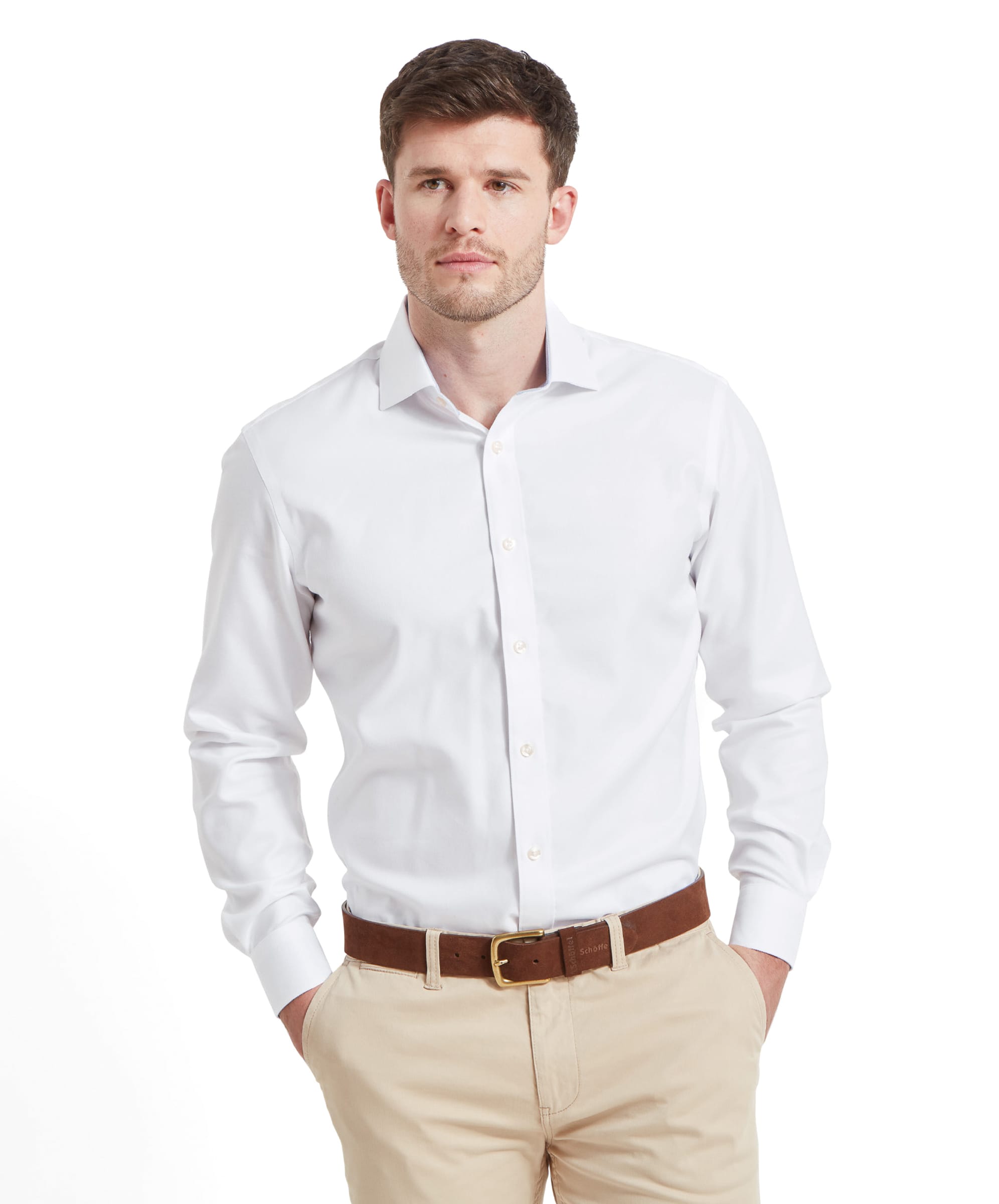 Model wearing the Schöffel Greenwich Tailored Shirt for Men in White, with hands in pockets.