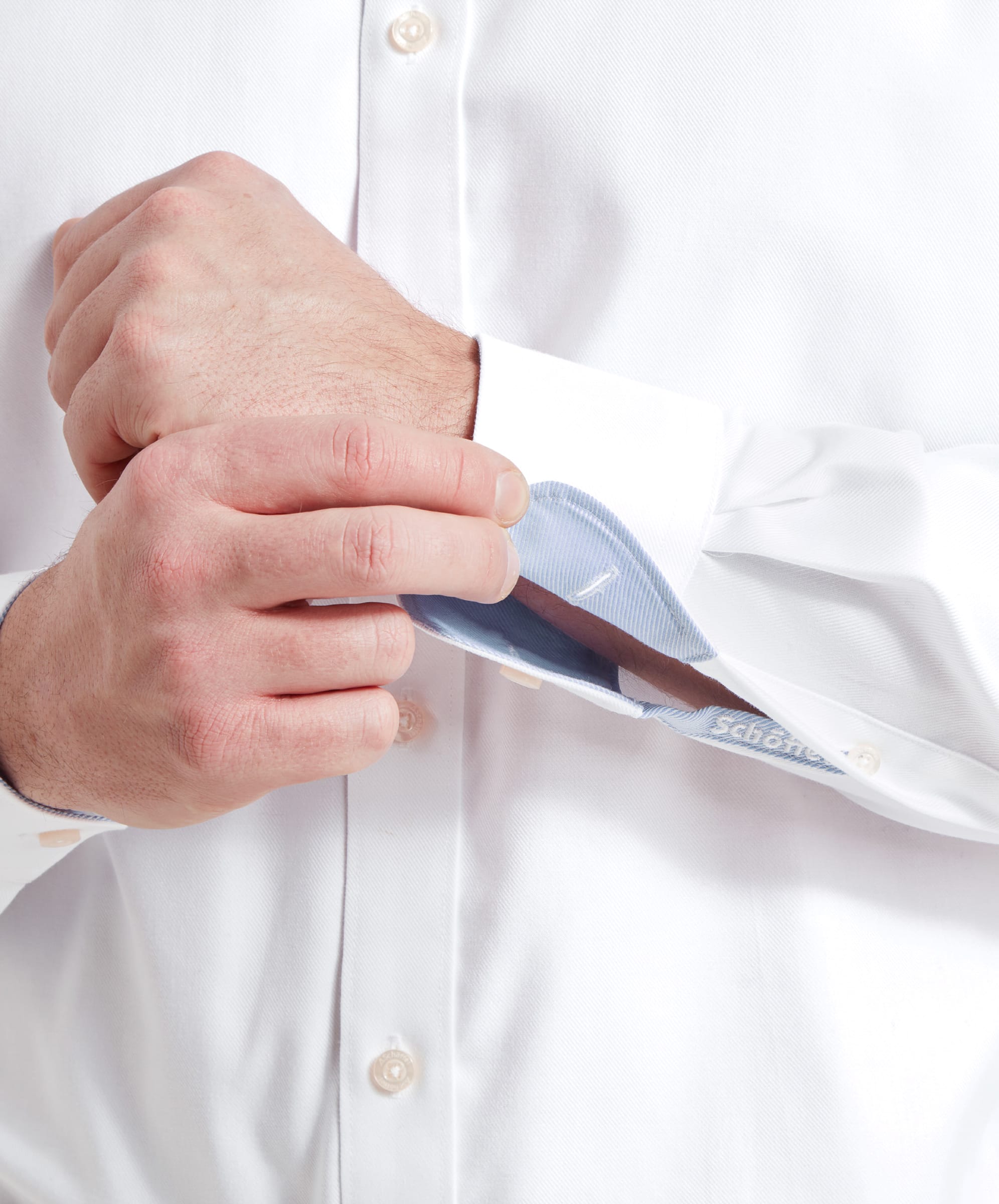 Close-up of cuff and sleeve of the Schöffel Greenwich Tailored Shirt for Men in White.