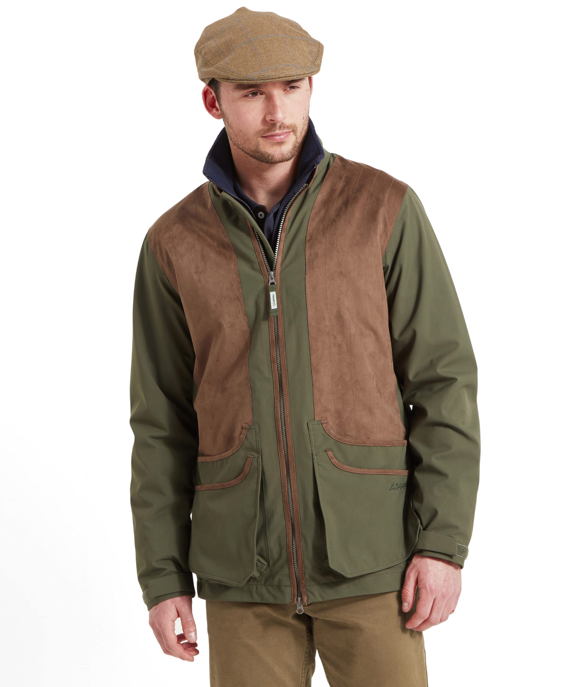 A man wearing the Schöffel Grimsthorpe Clay Shooting Jacket in Green, paired with a flat cap, showcasing the jacket's front design.