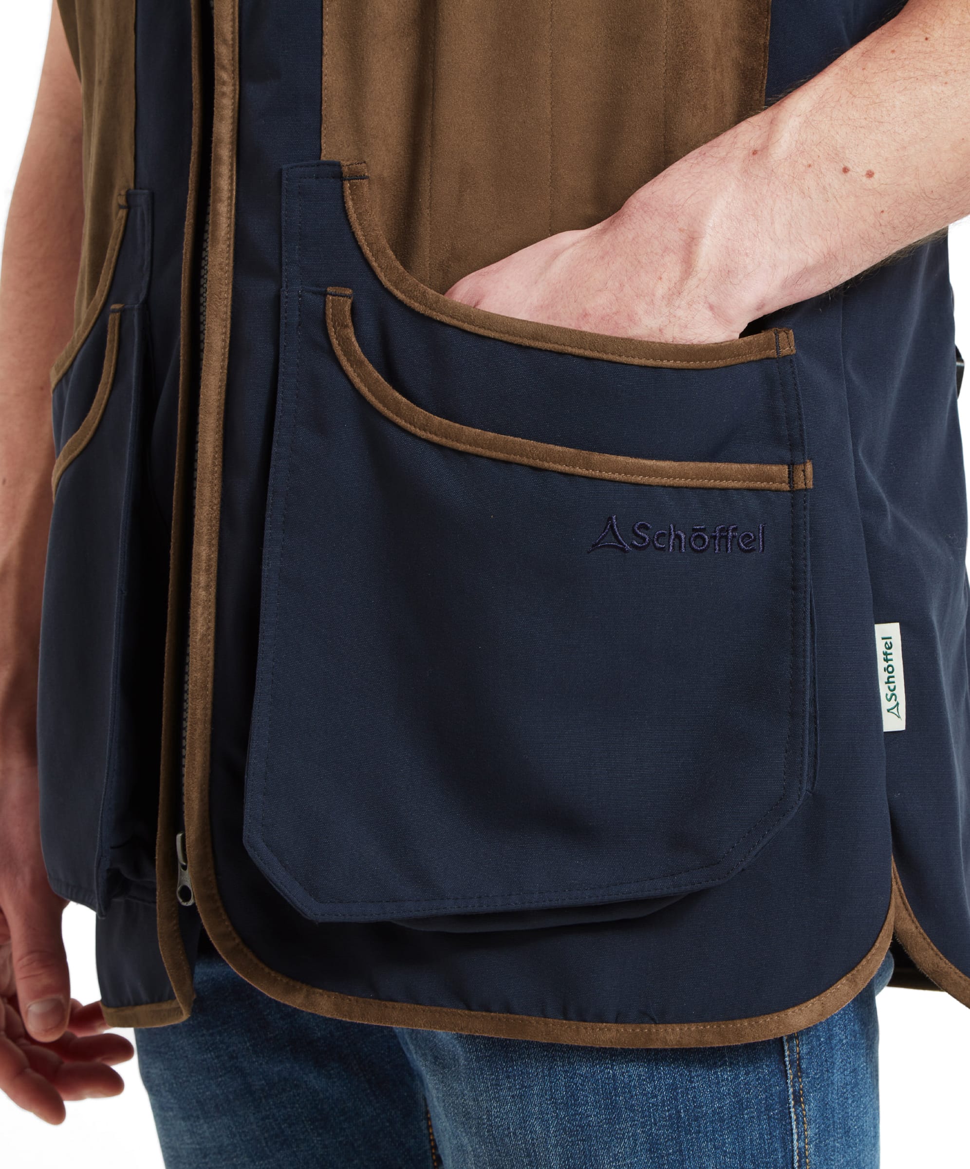 Detail view of the security pocket of the Schöffel Grimsthorpe Clay Shooting Vest for Men in Blue, showcasing the zipper.