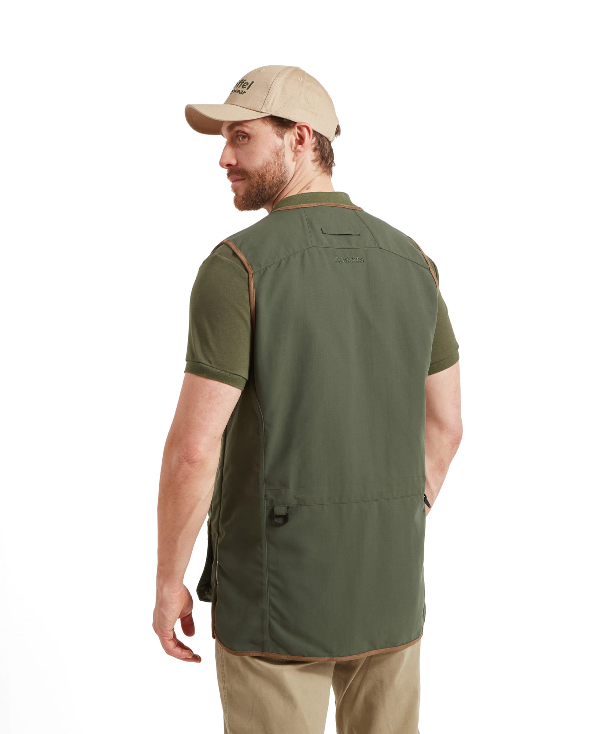 Back view of the Schöffel Grimsthorpe Clay Shooting Vest for Men in Green, showcasing the back detailing. He peers over his shoulder.