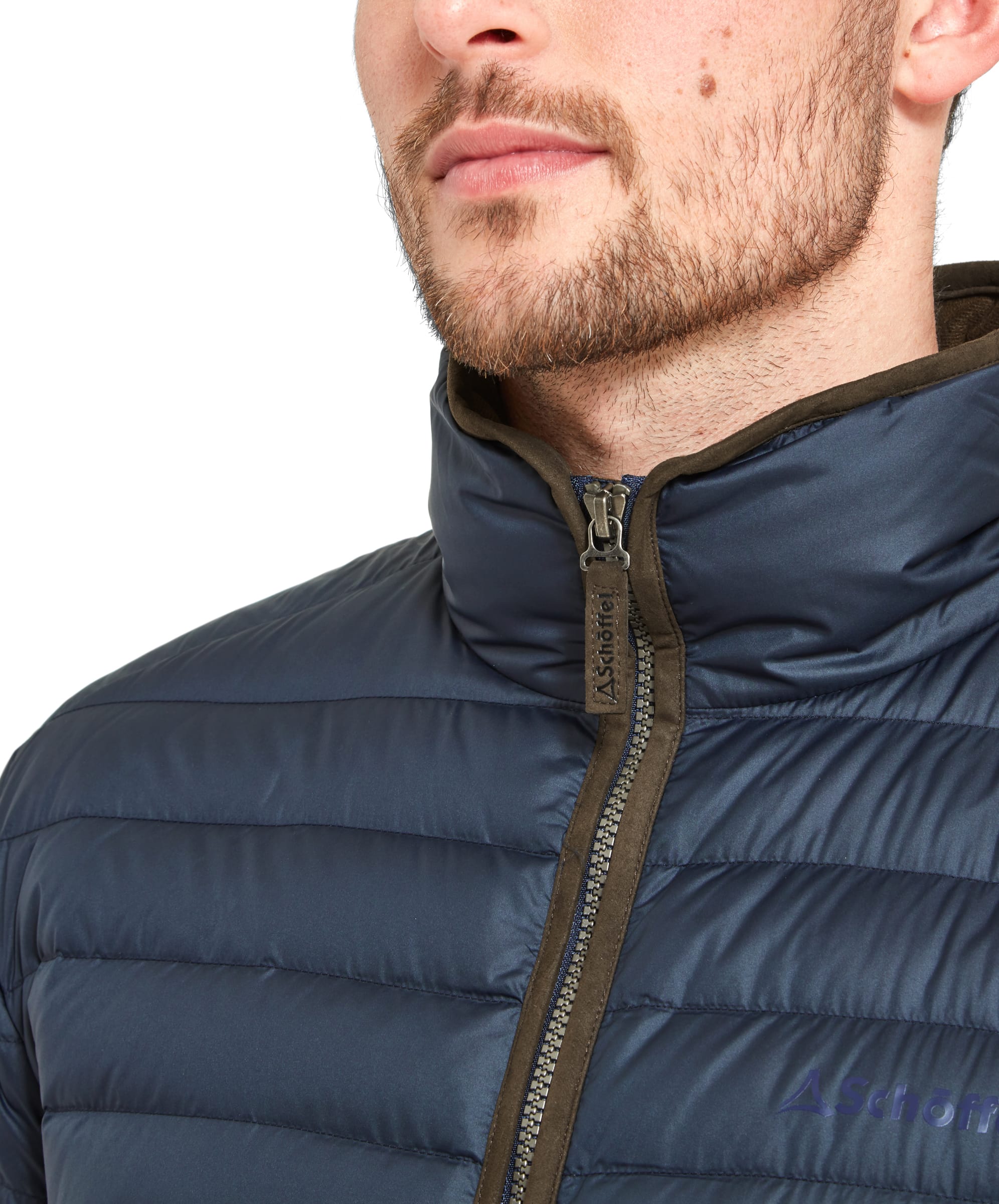 Close-up on the collar and zipper pull on the Schöffel Hallaton Down Jacket for Men in Blue. The zipper pull is finished with the brand name.