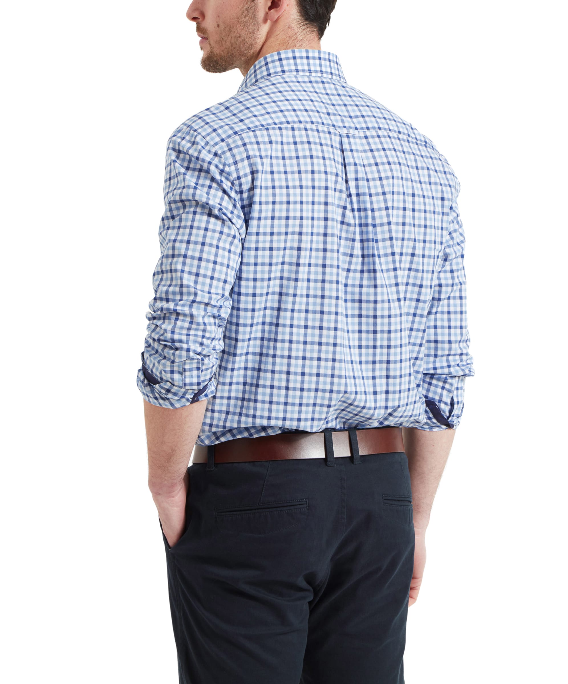 Back view of the Schöffel Hebden Tailored Shirt for Men in Blue Navy showing the fit and shape of the shirt. The man has the sleeves rolled up his forearms.