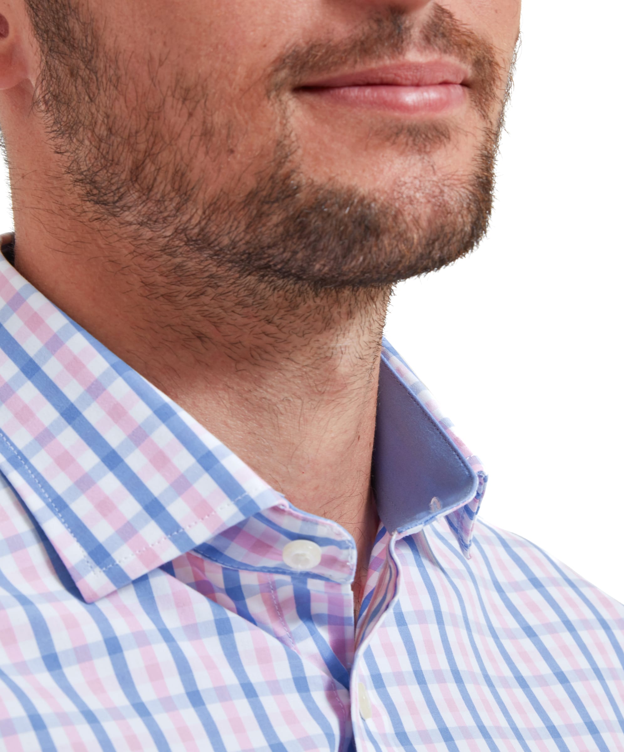 Close-up view of the collar on the Schöffel Hebden Tailored Shirt for Men in Blue and Pink, highlighting the light blue collar lining as the first button is undone.