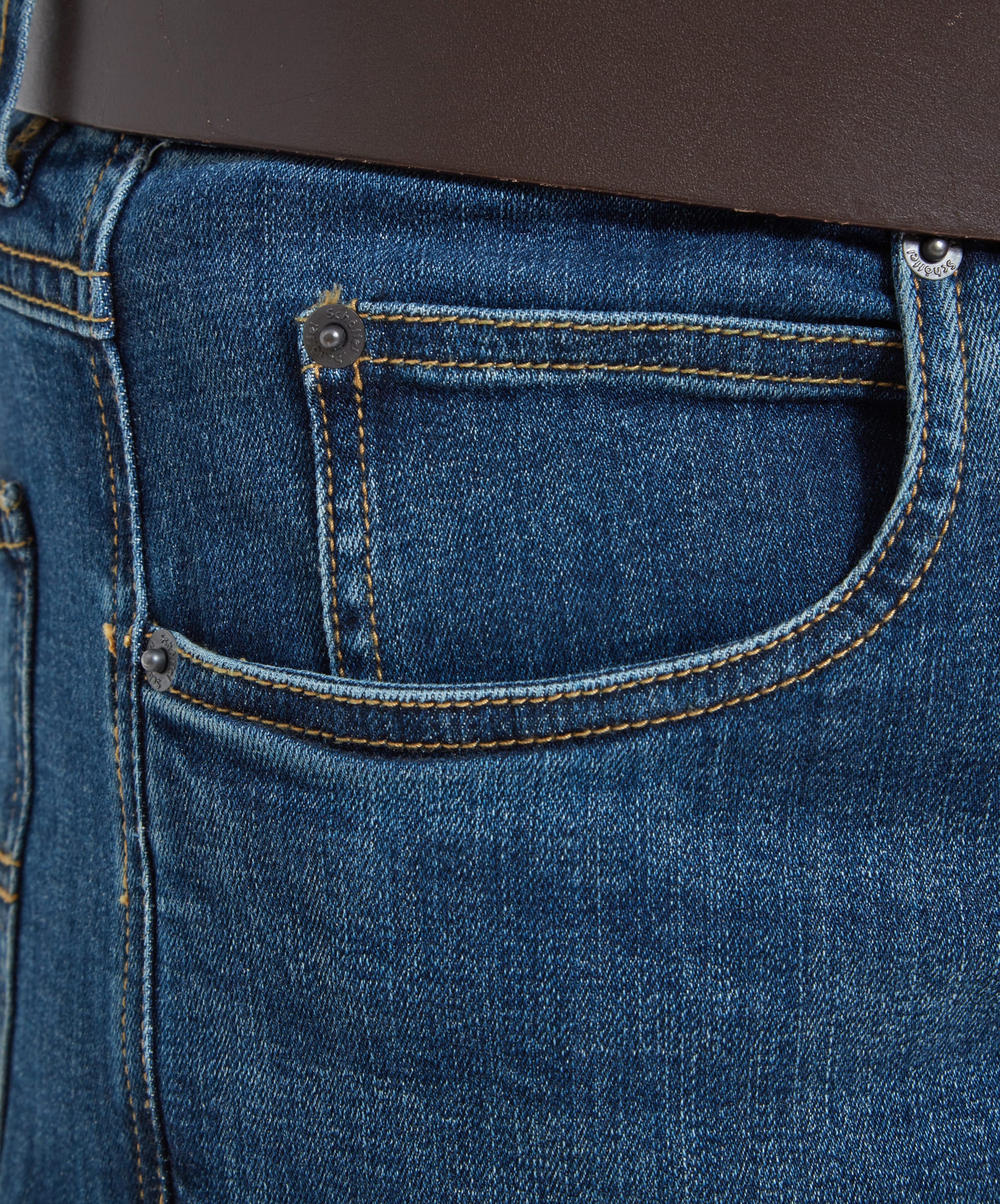 Close-up of the left side pocket on the Schöffel James Jean for Men in Blue highlighting the traditional pocket watch pocket. The edges are topstitched with a golden thread and gunmetal branded rivets.