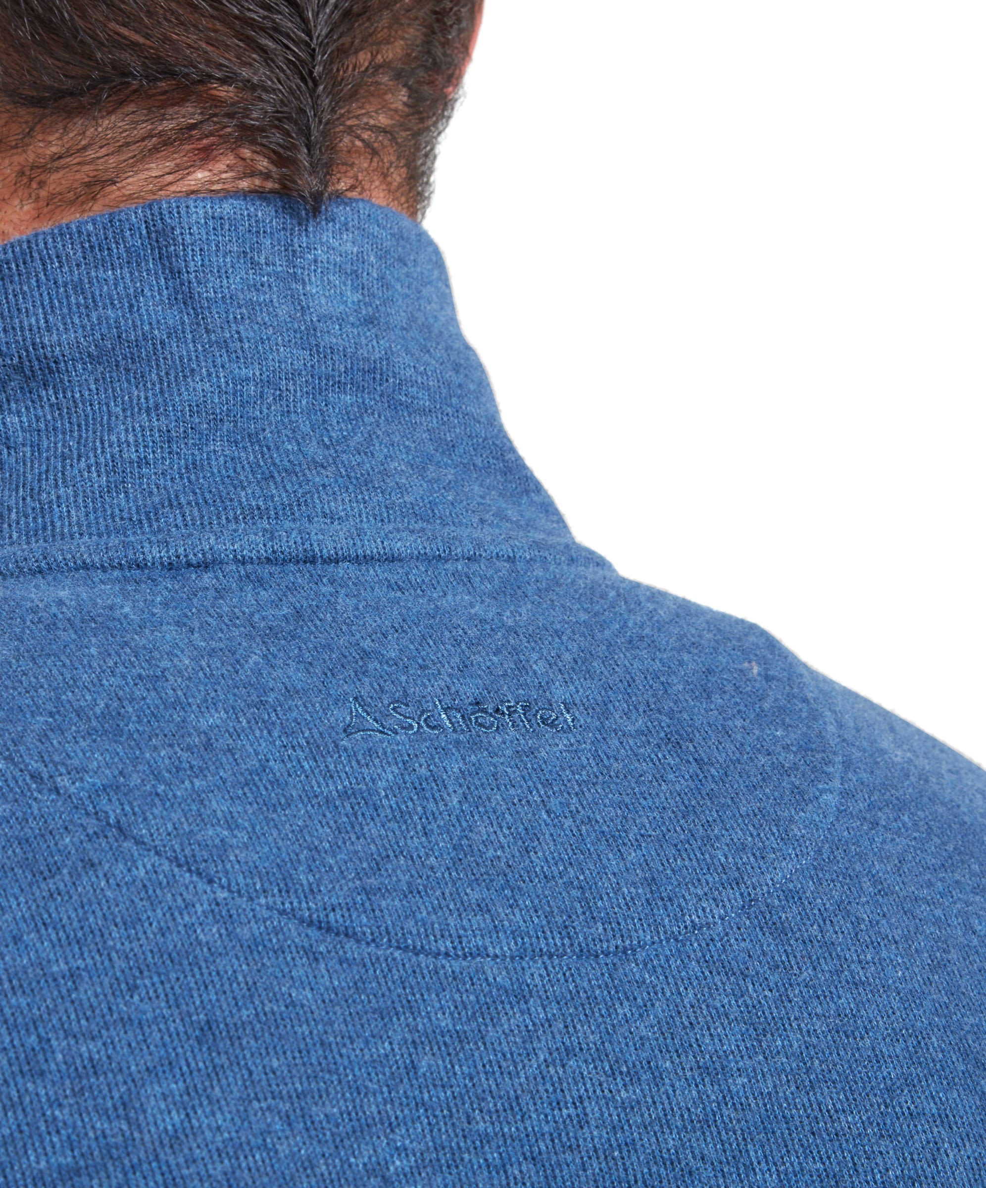 Close-up of the back of the neck on the Schöffel Kingsbridge Cotton French Rib 1/4 Zip for Men in Blue highlighting the tonal embroidered Schöffel branding.