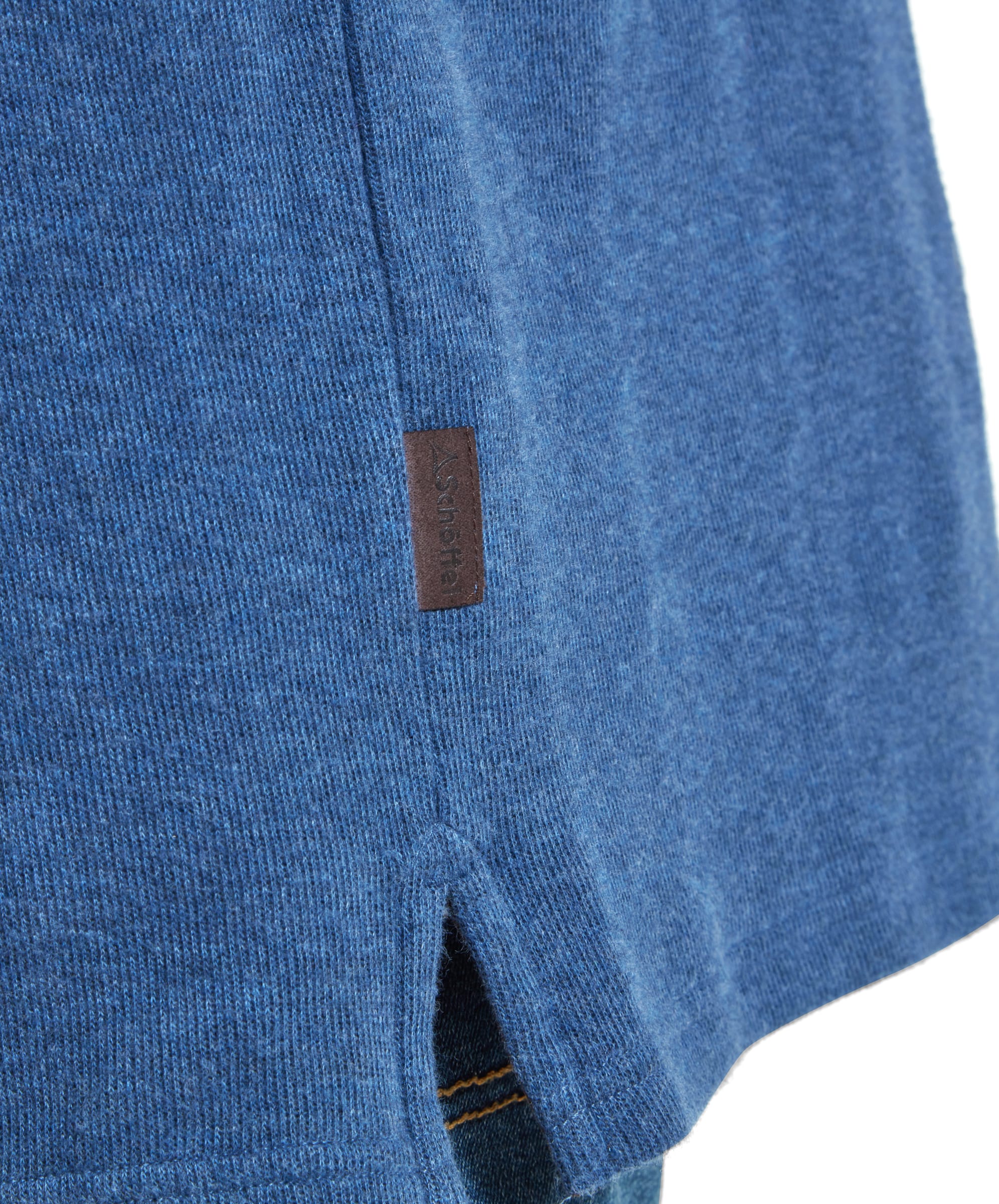 Close-up of the faux leather tag sewn into the side seam on the right hand side of the Schöffel Kingsbridge Cotton French Rib 1/4 Zip for Men in Blue