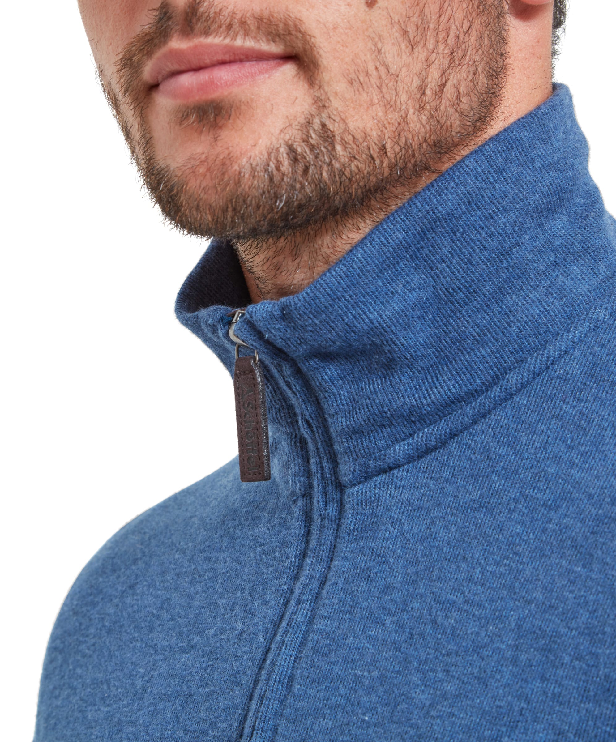 Close-up of the Schöffel Kingsbridge Cotton French Rib 1/4 Zip for Men in Blue highlighting the Schöffel faux leather pully.