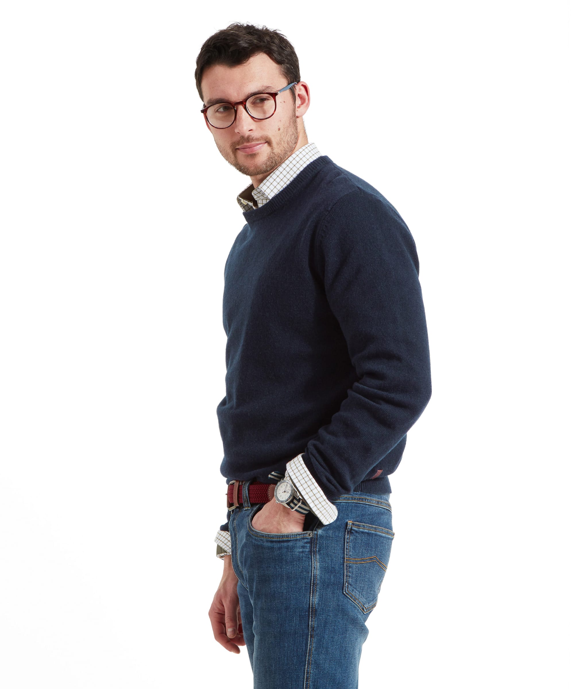 Side view of the same man looking to thr right of the camera, wearing the Schöffel Lambswool 1/4 Zip for Men in Navy