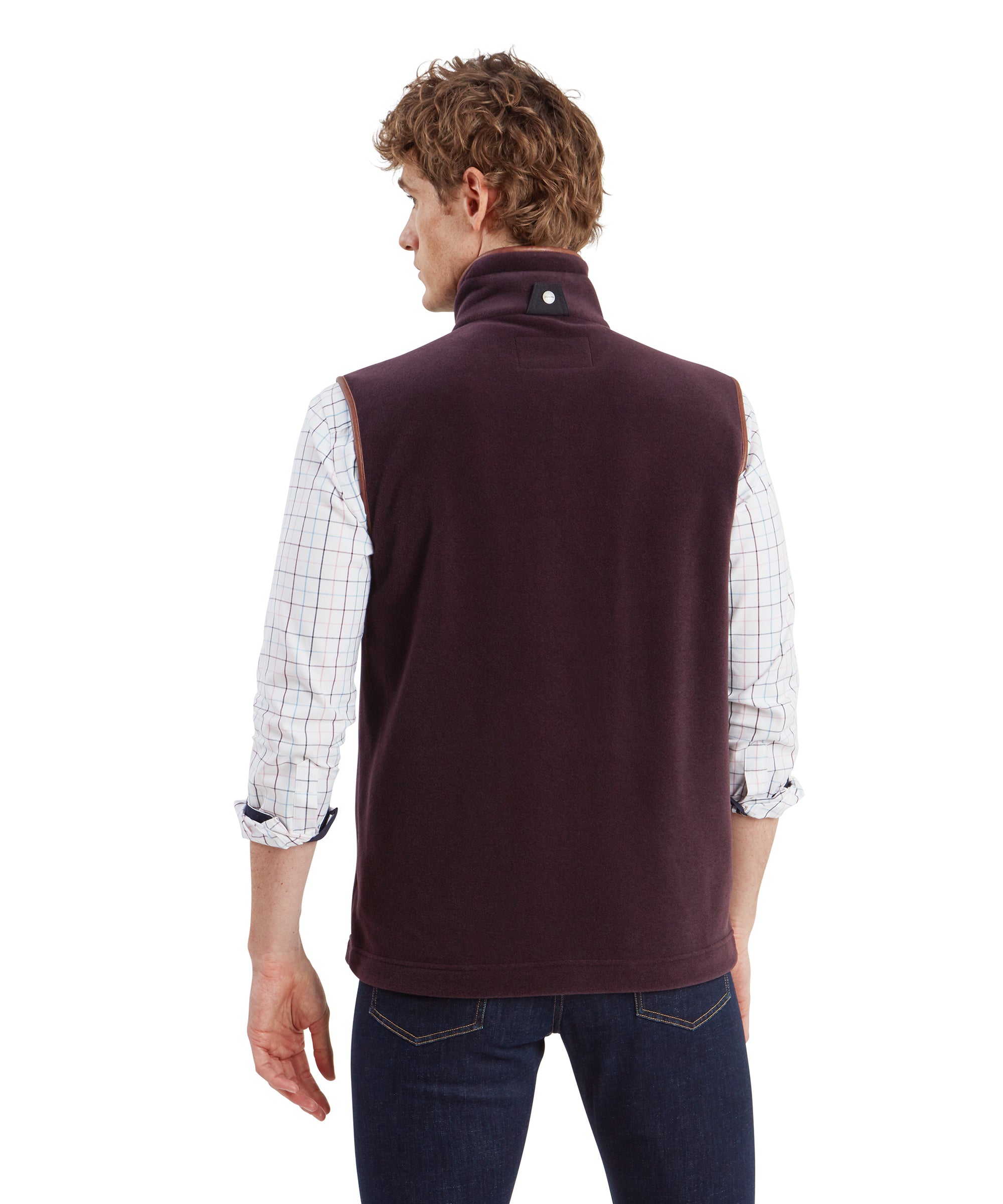 A rear view of the Schöffel Oakham Fleece Gilet for Men in Brown highlighting the loose fit and the lustre to the fleece fabric. A Schöffel branded tab can be found at the back of the neck with a black fabric tab.