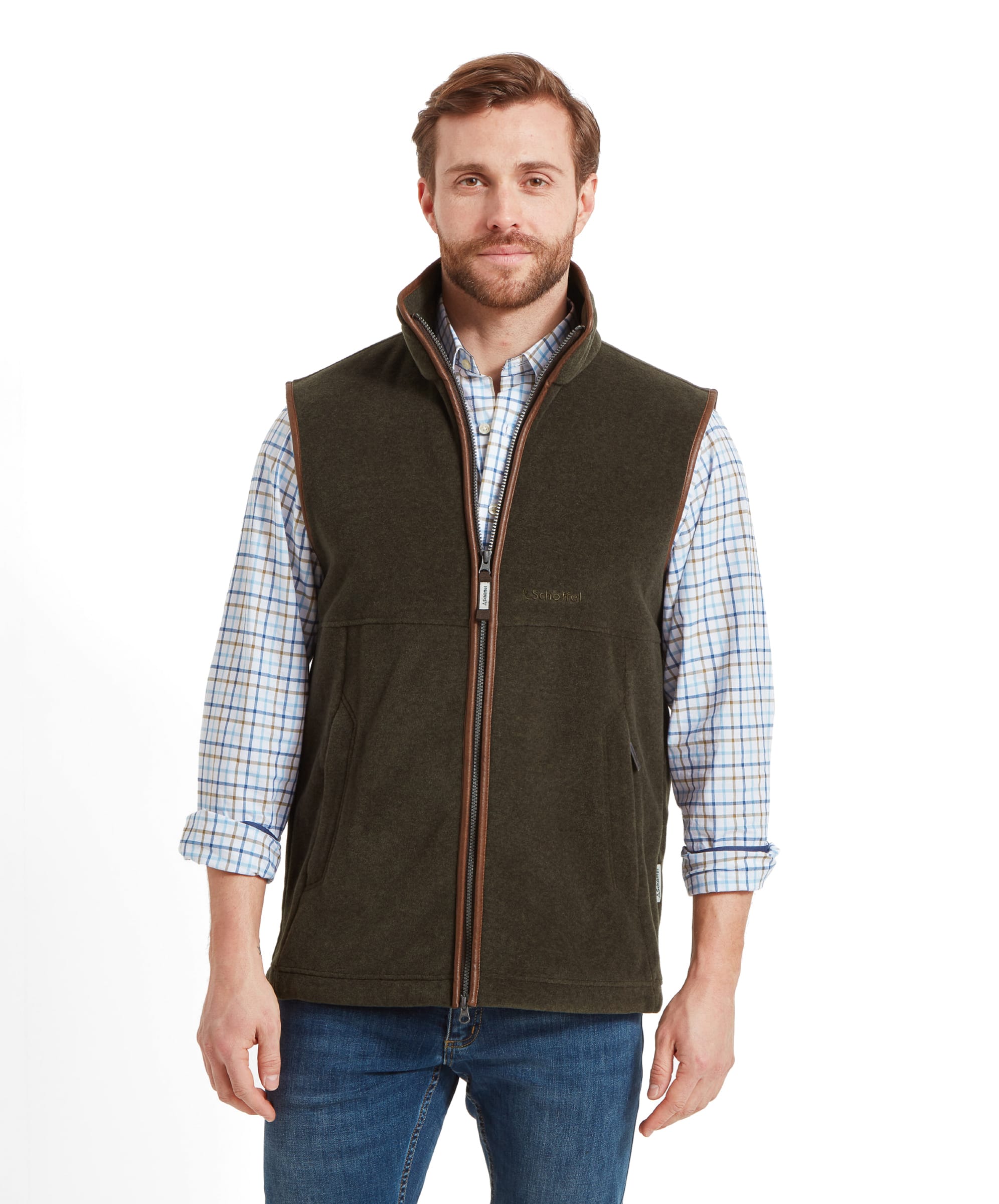 A man modeling the Schöffel Oakham Fleece Gilet for Men in Olive Green, featuring a cozy, classic design with a zip-up front and high collar.